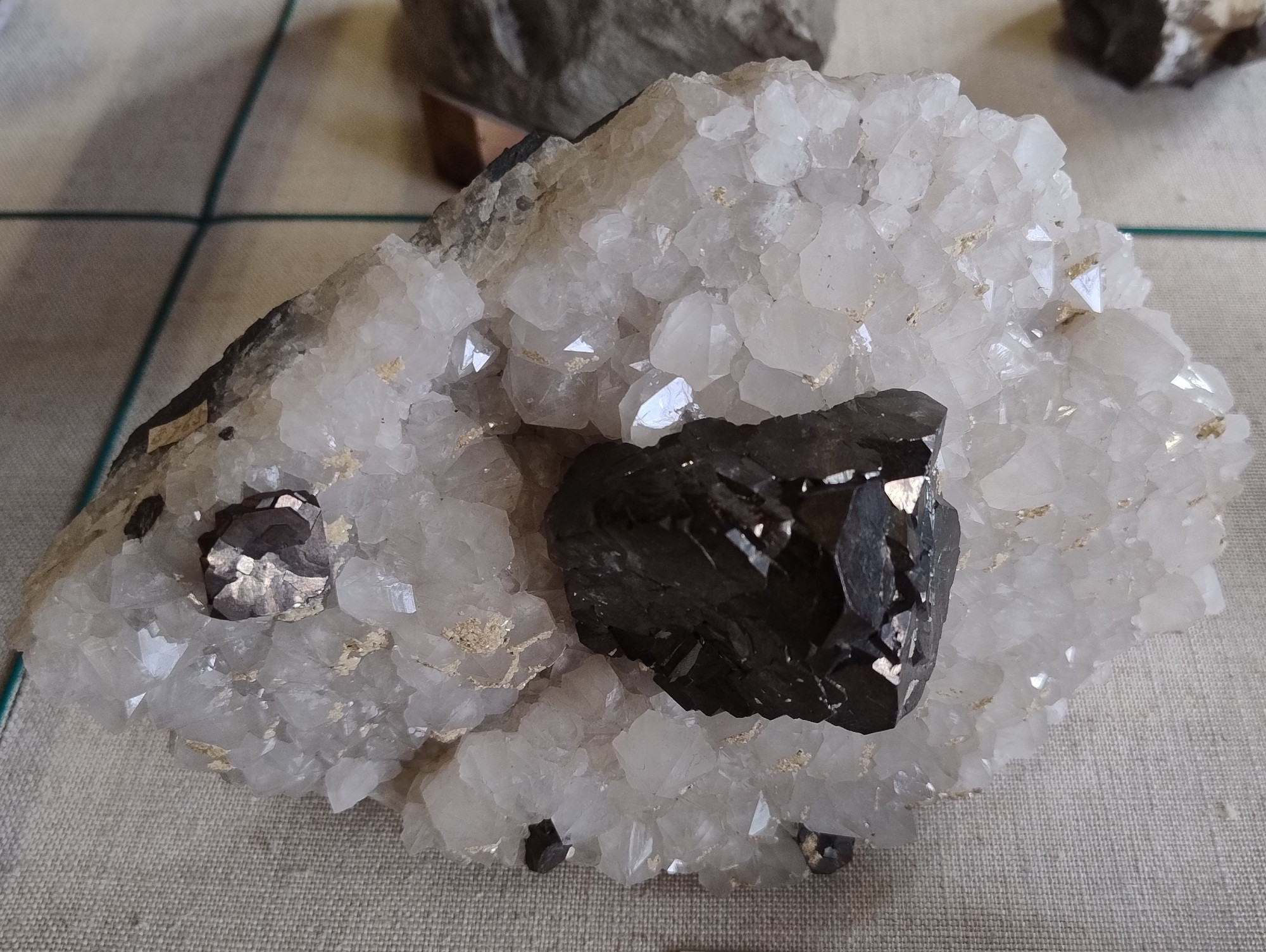 Dark metallic grey composite galena cubes nestled in colourless quartz crystals. From Menheniot Mine, Cornwall, England, UK.

Specimen on display in the Natural History Museum, London.