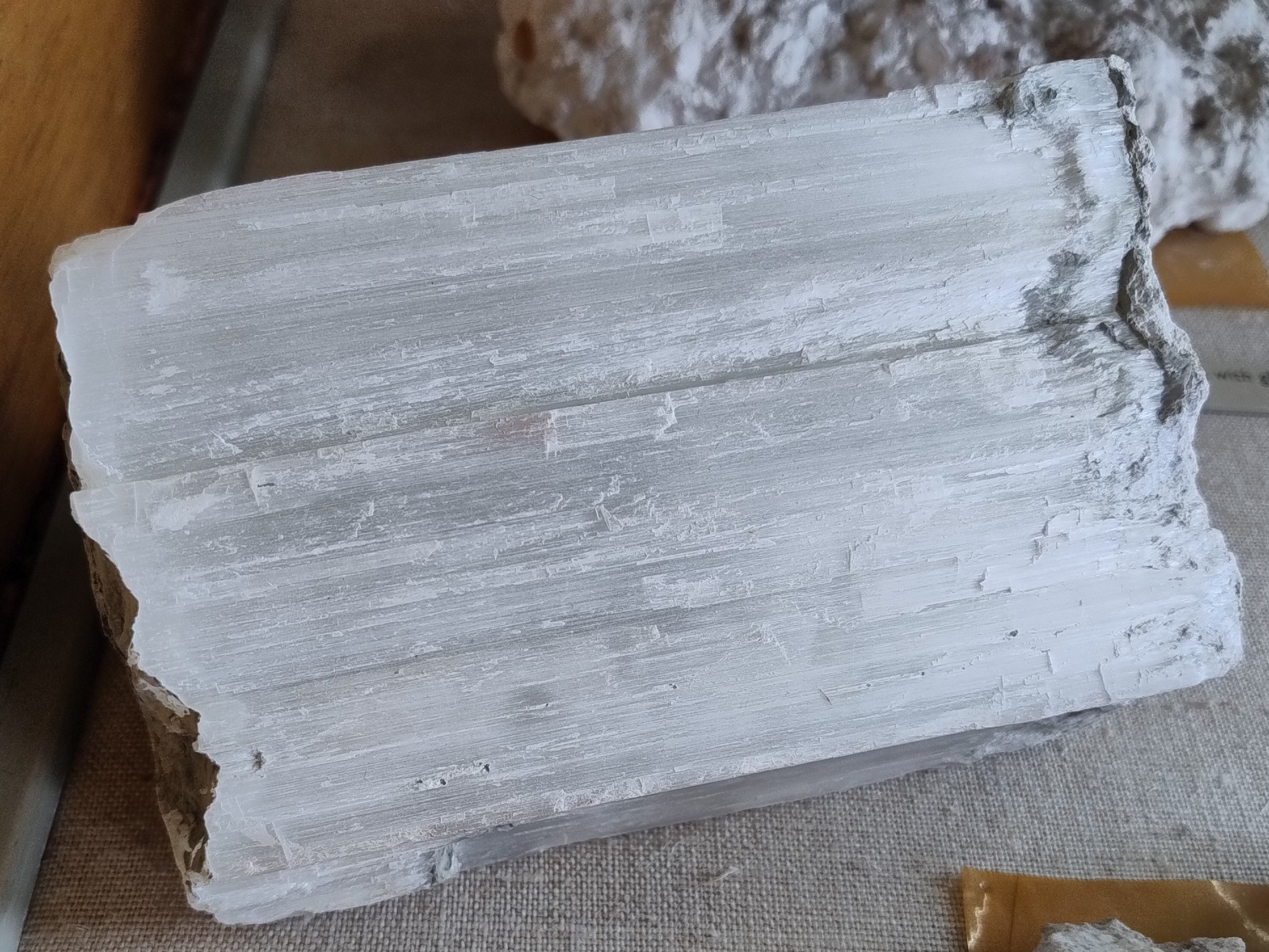 A compact, fibrous mass of ulexite with a silky sheen. From Boron, California. USA.

Specimen on display in the Natural History Museum, London.