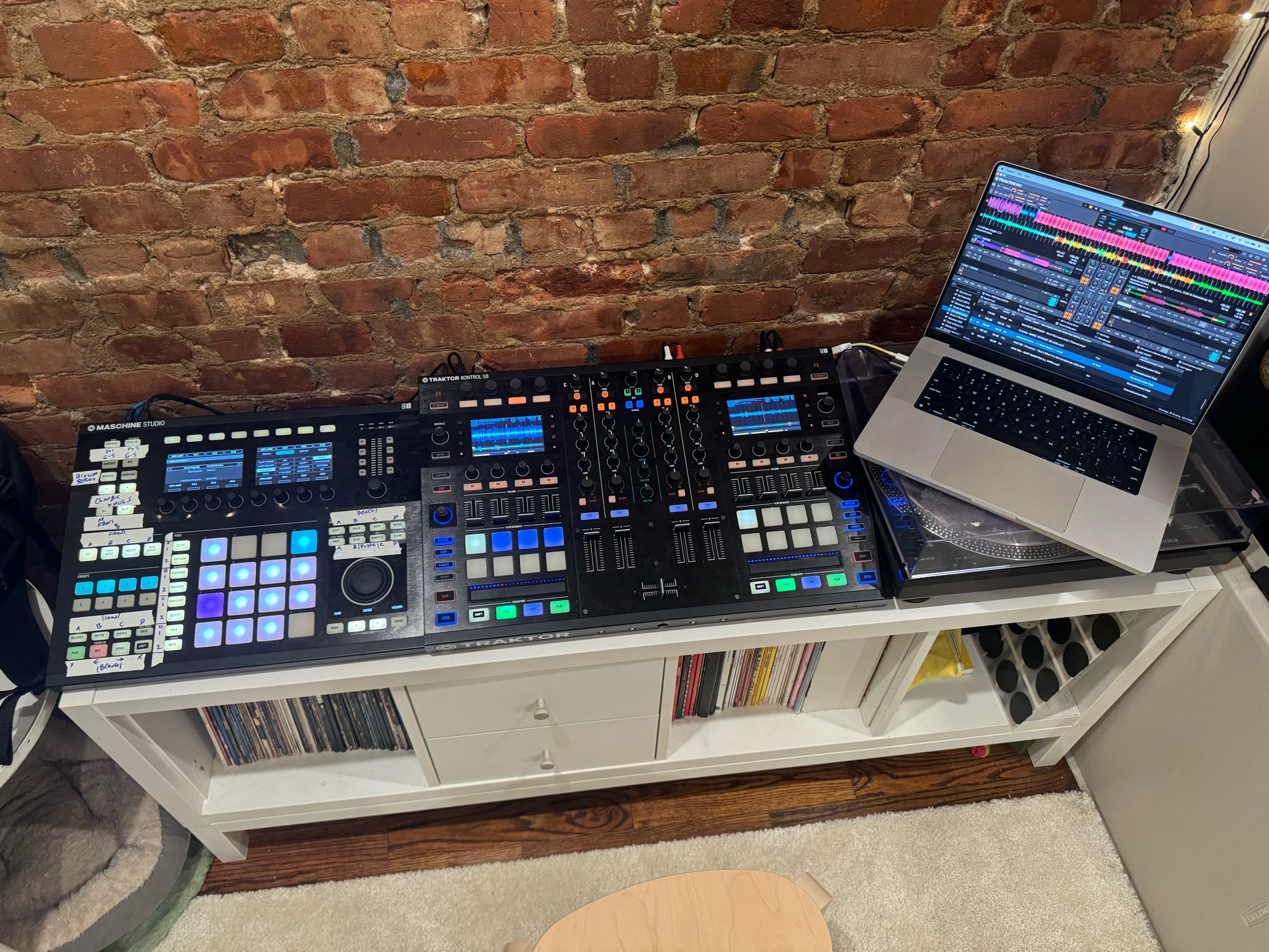 A traktor s8, machine studio, record player and laptop