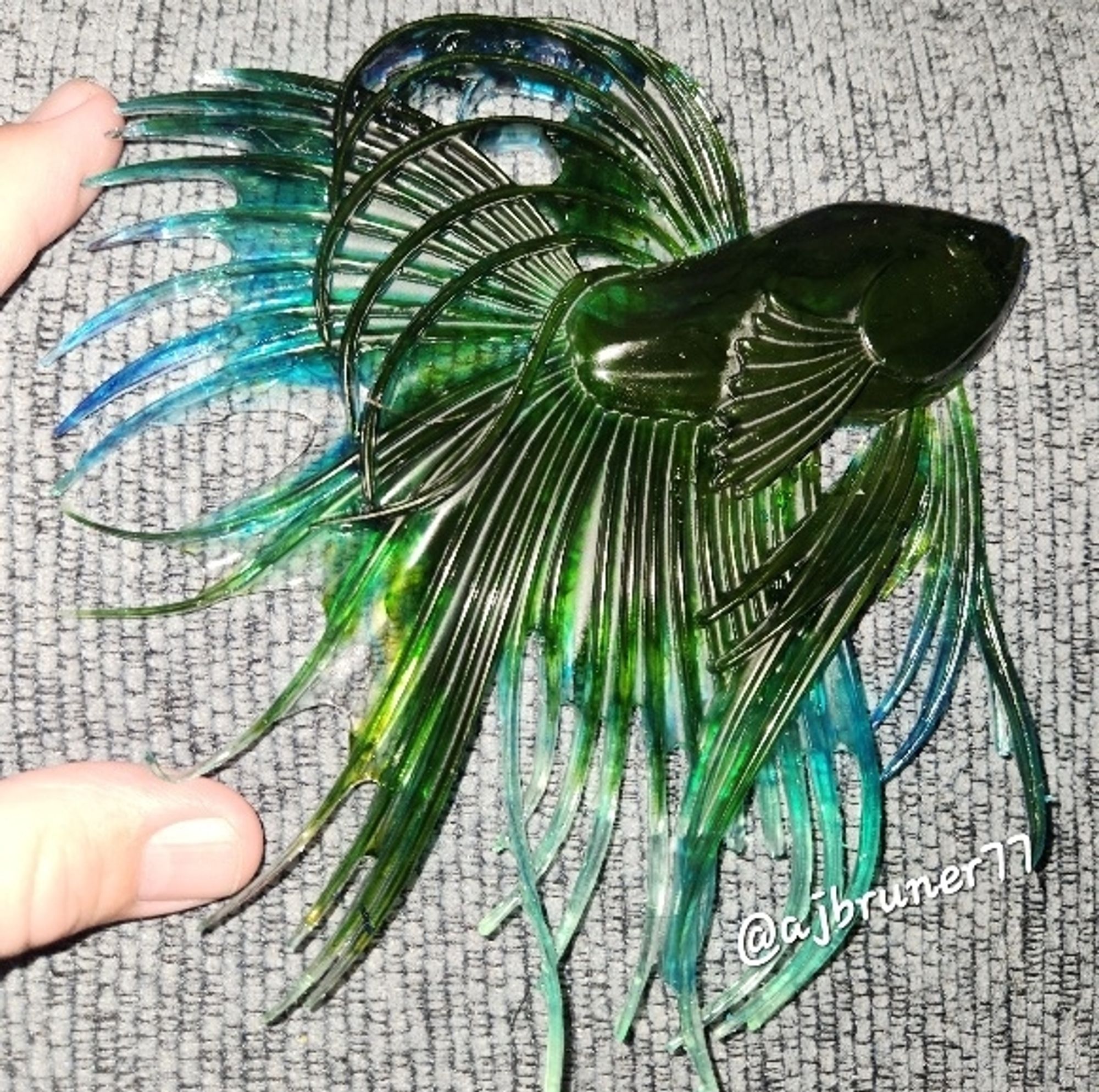 Sample resin project: palm-sized fancy fish in a green and blue blend for #ColoringTherapy