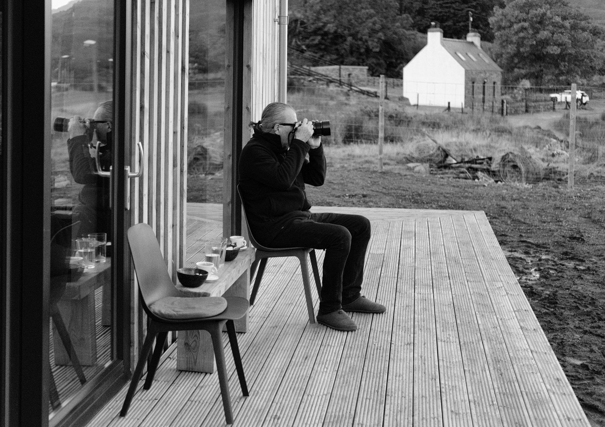 A photo of Paul looking across to Liathach in morning light, camera up. Torridon, Wester Ross, Scottish Highlands.

Photo by and Copyright of Lynn Henni.