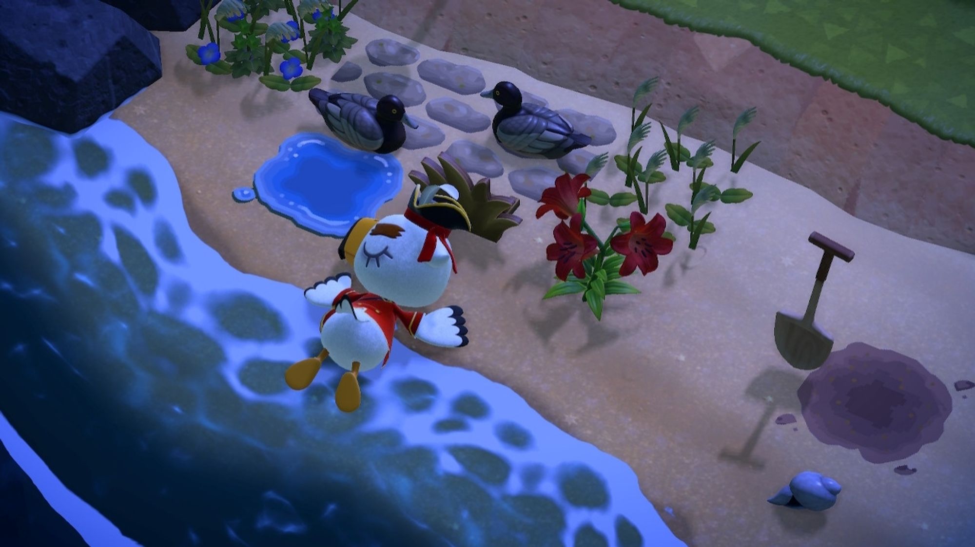 Pirate Gulliver sleeping on my beach. He's by 2 ducks, a grass standee, a red flower and a shovel.