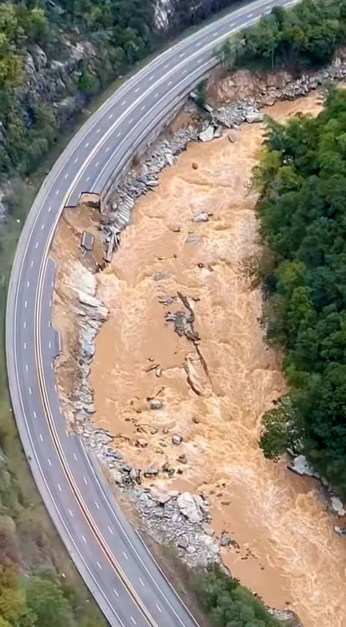 I-40 showing multiple areas of damage along the Pigeon River IN NC