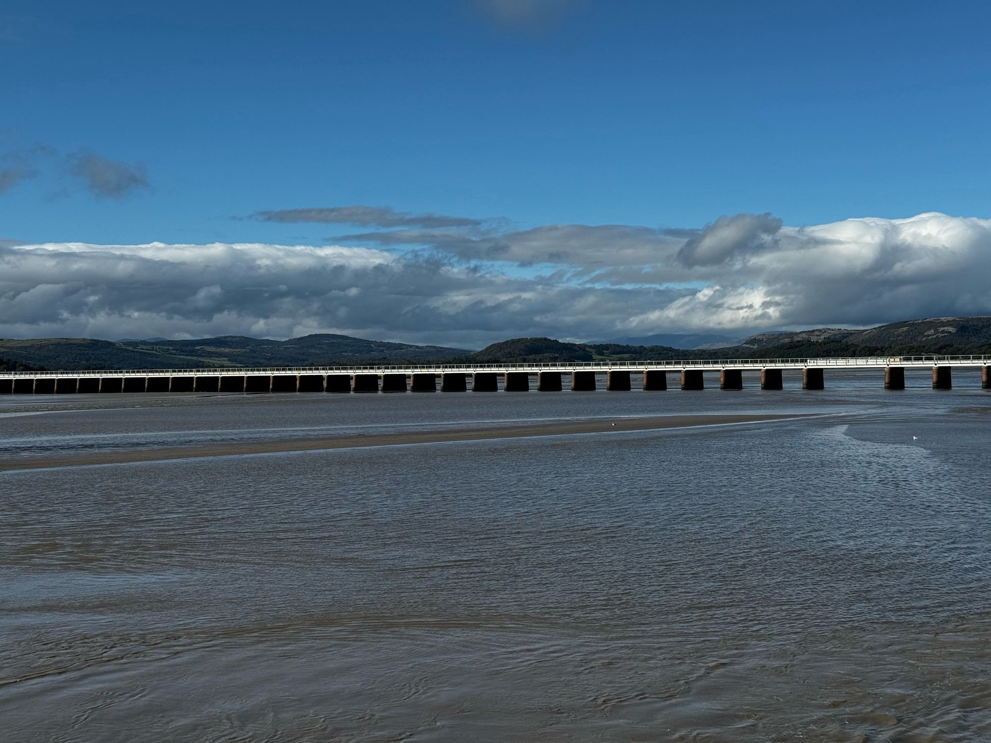 View of the Arnside to Grange rail line bridge in sunlight