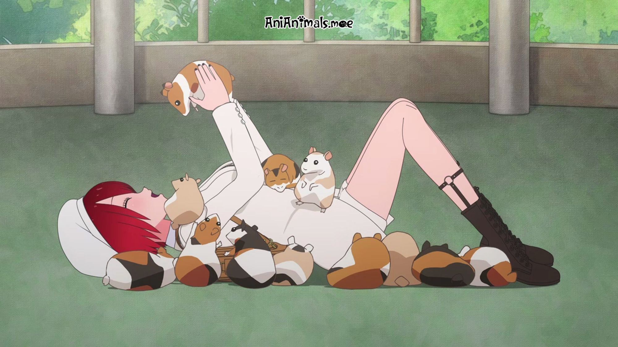 A red haired girl playing with hamsters