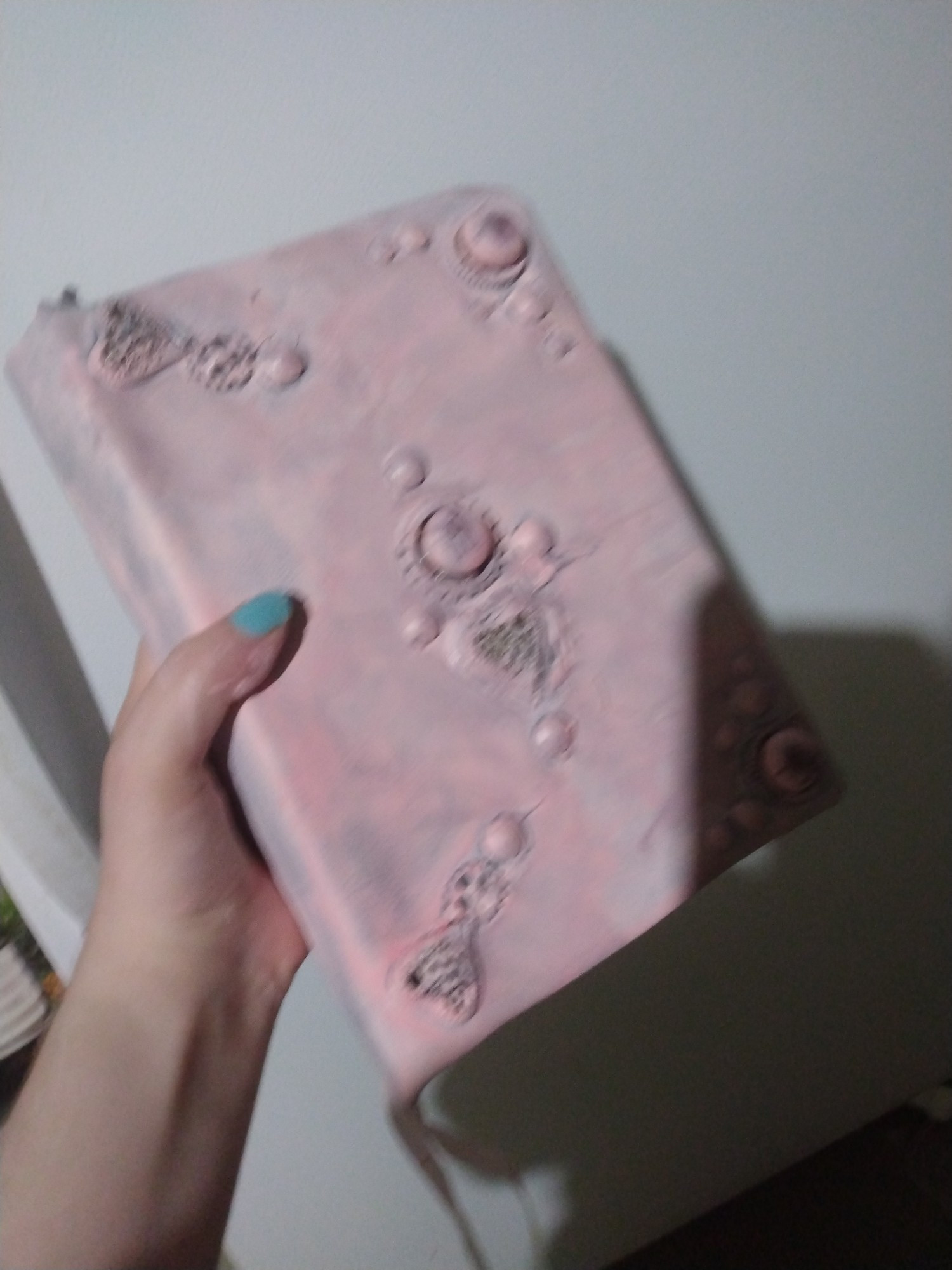 A pink leather bound steampunk spellbook