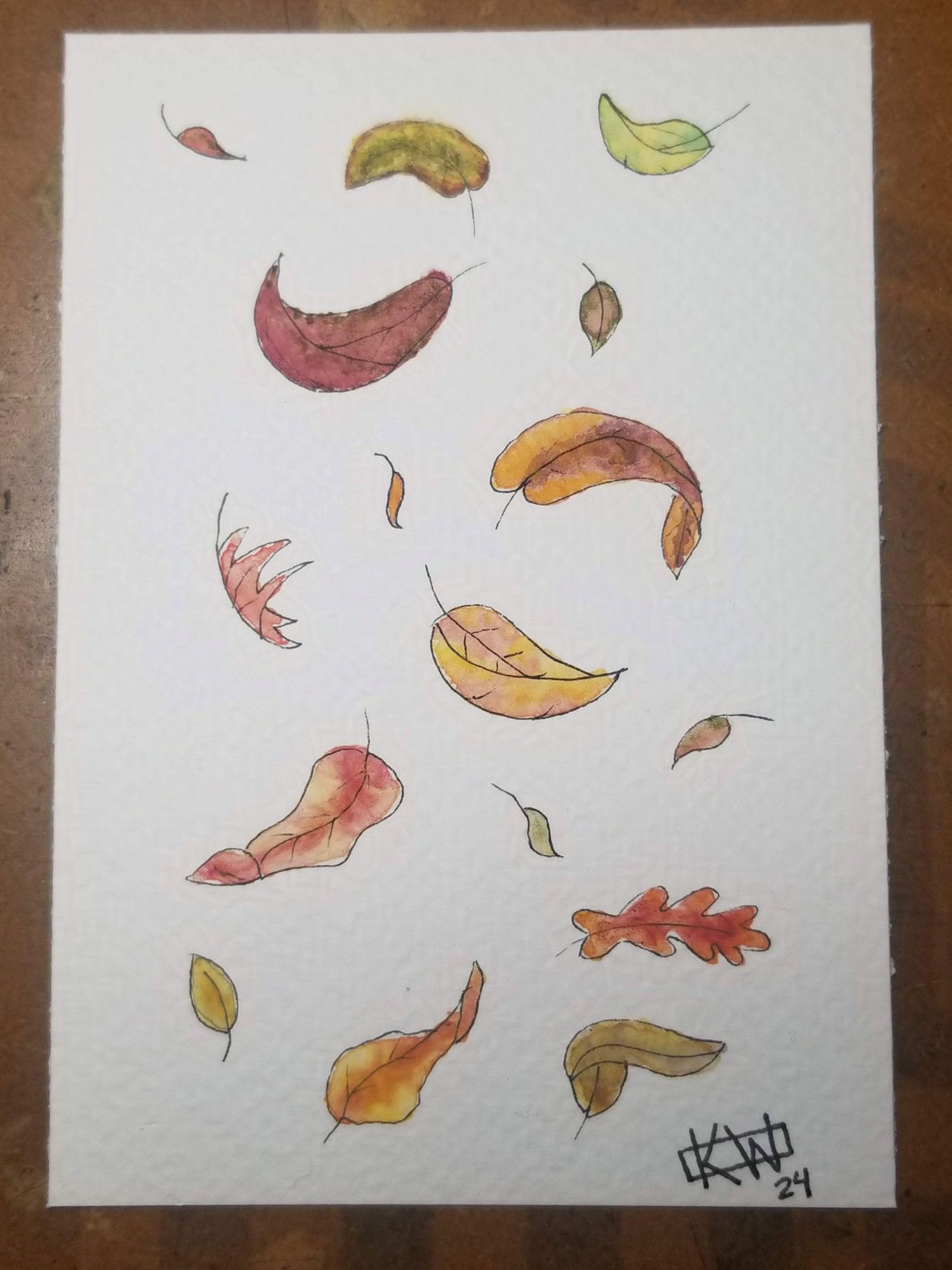 Watercolor of falling autumn leaves in greens, yellows, reds, oranges & purples.