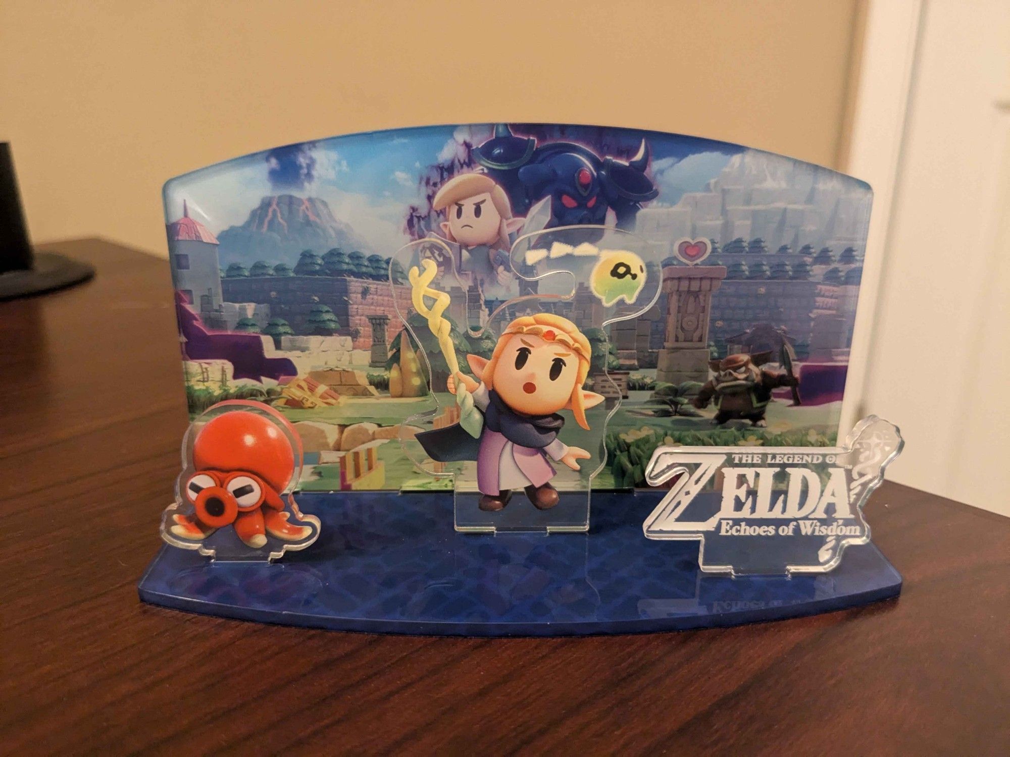 An acrylic stand featuring Zelda and an octorok