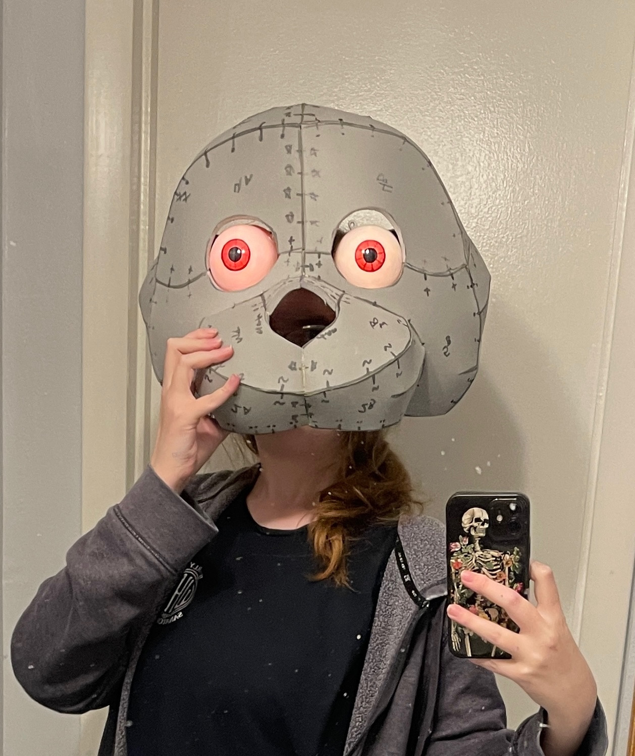 Mirror selfie with an in progress cosplay head of Bonnie from Five Nights at Freddy’s