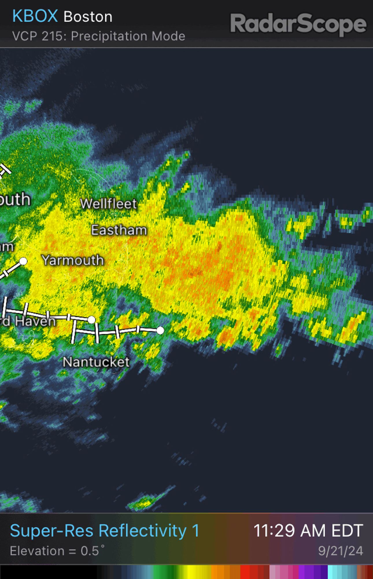 Weather radar image showing big plume of heavier rain (yellow with some orange) streaming in off the ocean onto outer Cape Cod. This has been happening for hours.