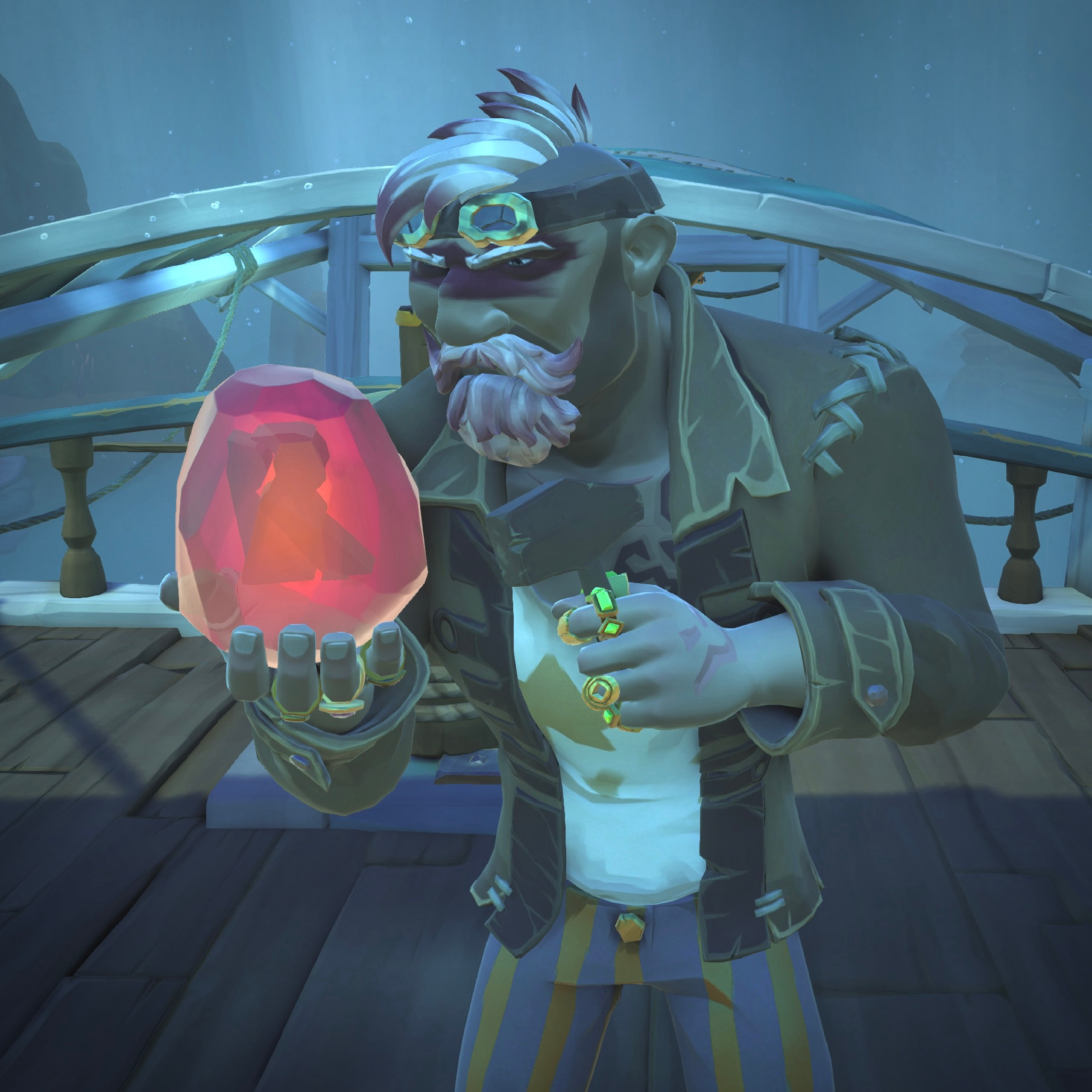 An image of Bruno’s sea of thieves pirate stood with a large ruby gem in his hand with the letter R inside it. He’s gently hammering away at the gem to get what’s inside.