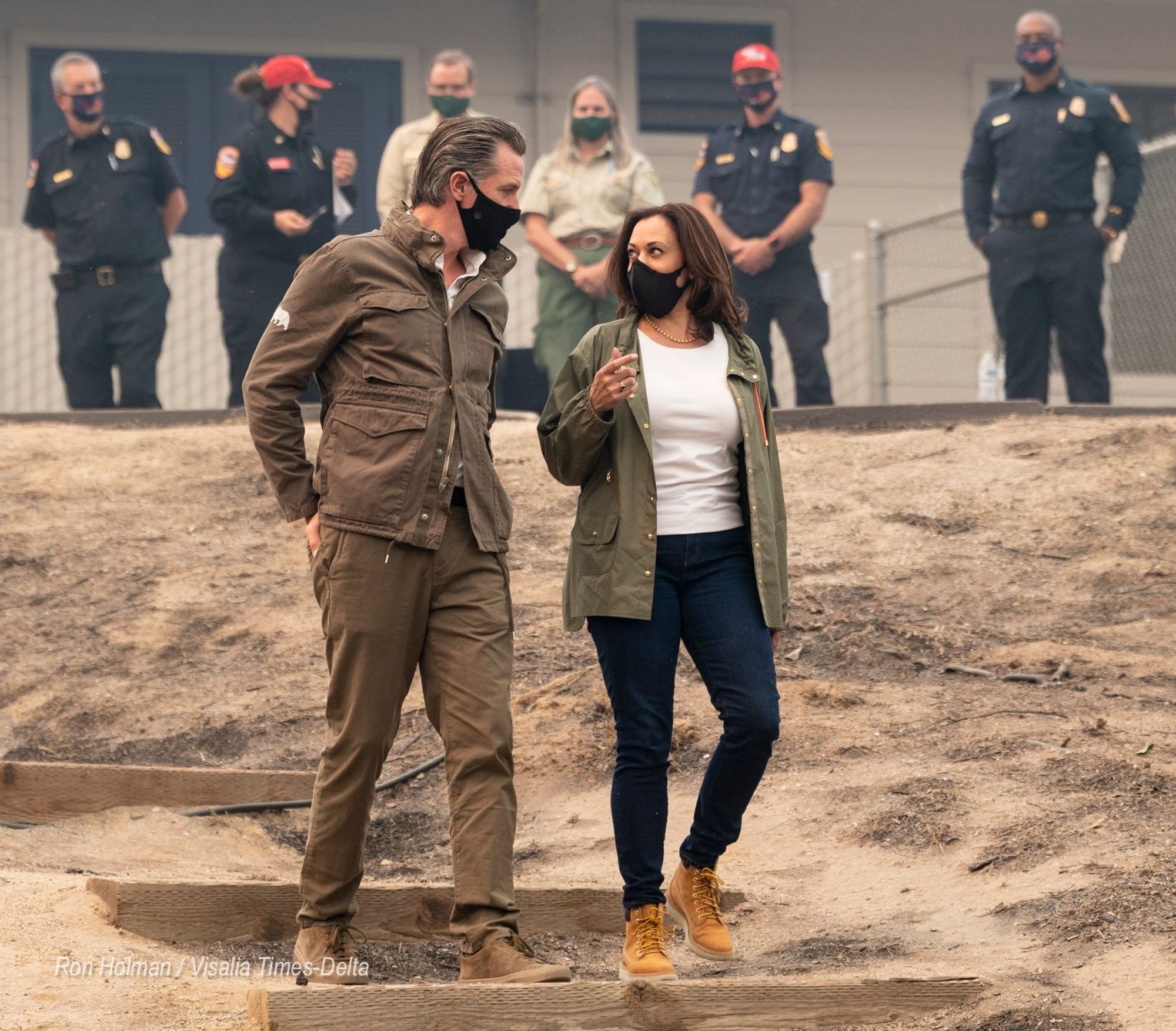 Do You Think They Intentionally Coordinated To Look Like Bond Villains?

in green m65 field jackets and black masks, Kamala Harris and Gavin Newsom visit a destroyed California town, flanked by law enforcement