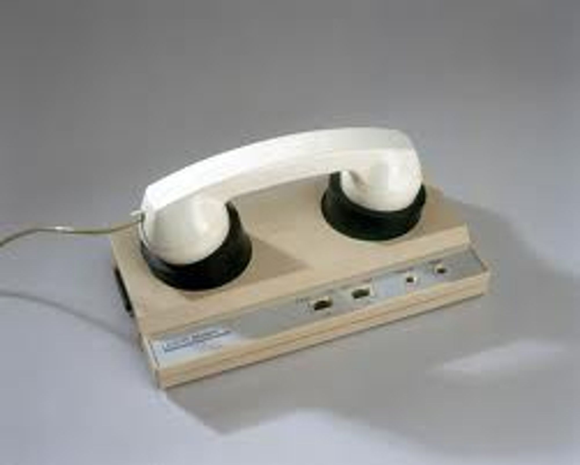 Acoustic coupler, a landline telephone mated to a modem