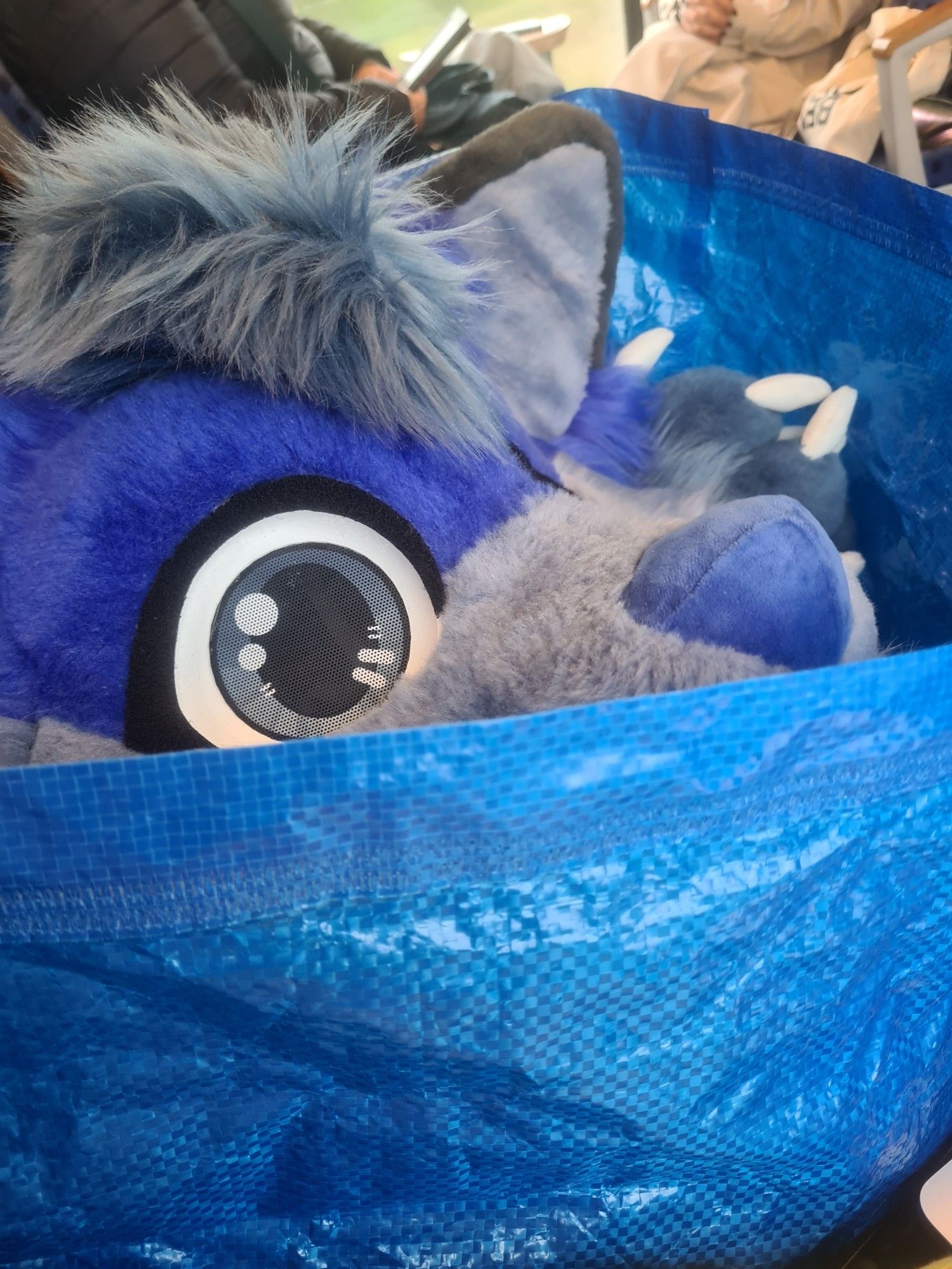 fursuit head in an ikea bag