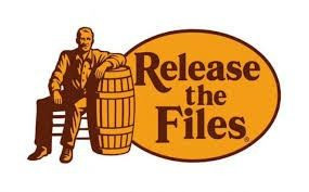 Satirical revision of the gold and brown Cracker Barrel logo with "Release the Files" in place of the business name. The logo comprises a man sitting on a chair or stool, facing forward with his left arm resting on a barrel. 