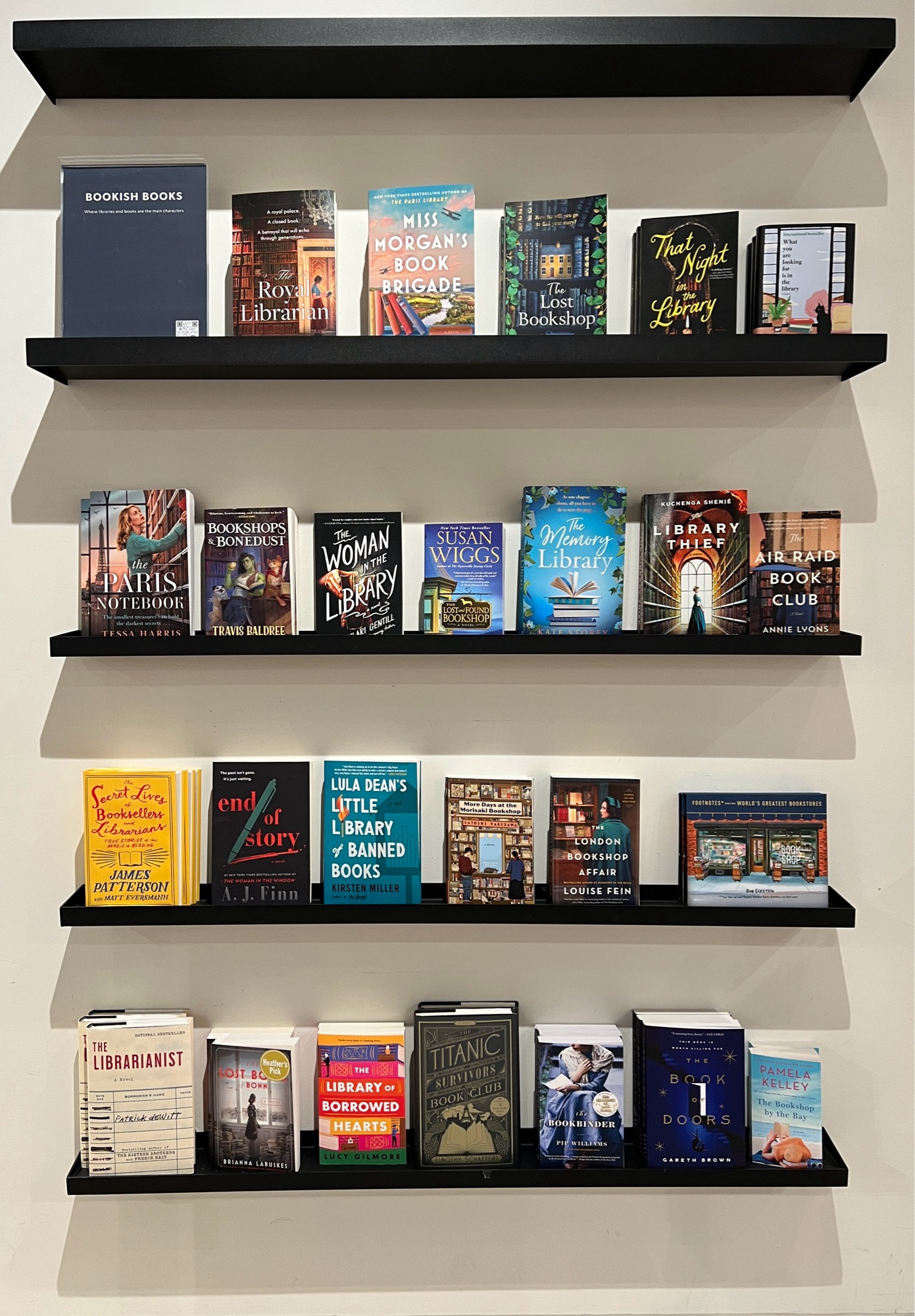 Books on display at a bookstore titled “Bookjsh Books” includes such titles as The Royal Librarian, the Library Thief, Bookshops & Bonedust, and more. If you want the whole list just @ me and I will get the full list for you.