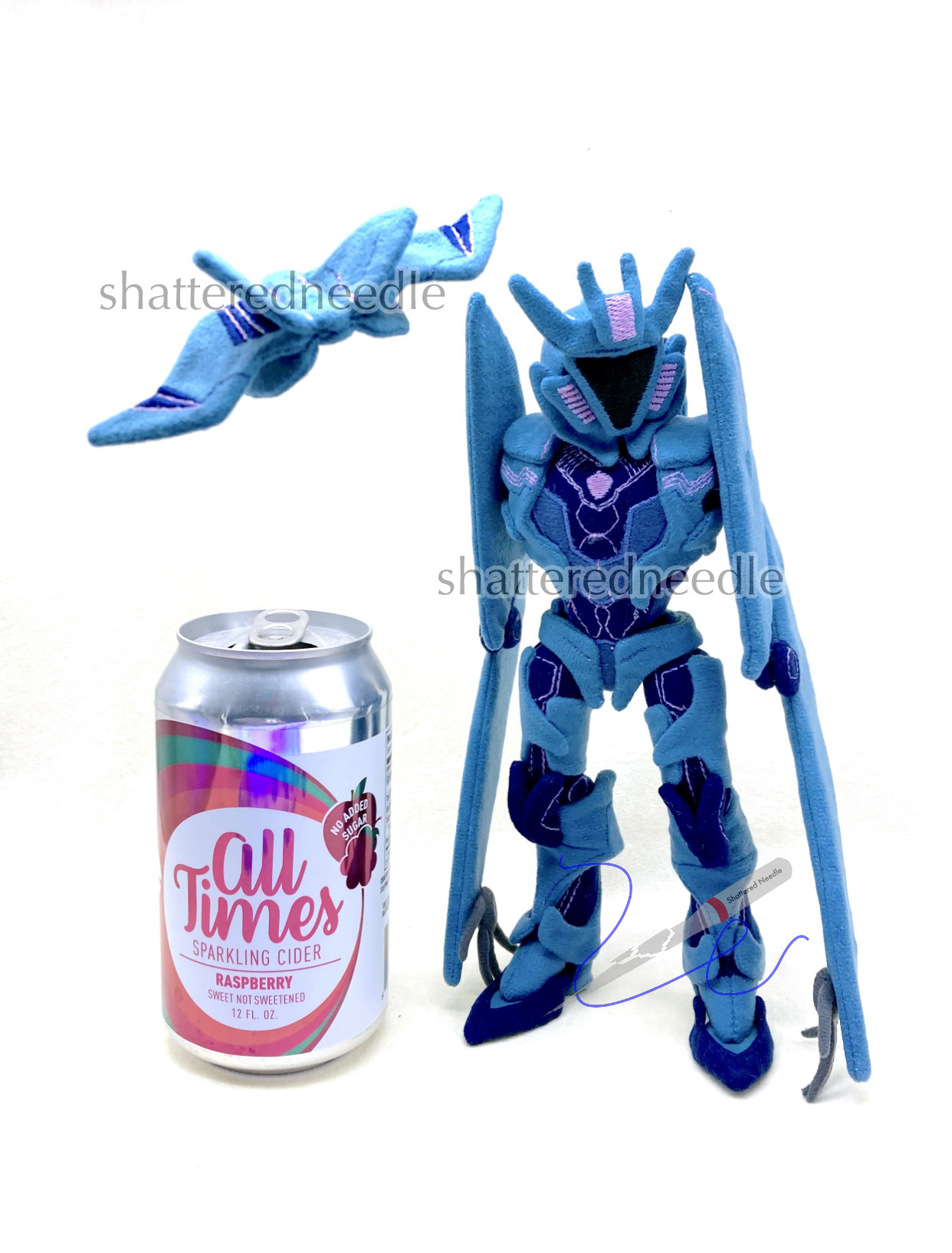 Custom handmade TF Prime Soundwave & Laserbeak plushies posed with a standard soda can