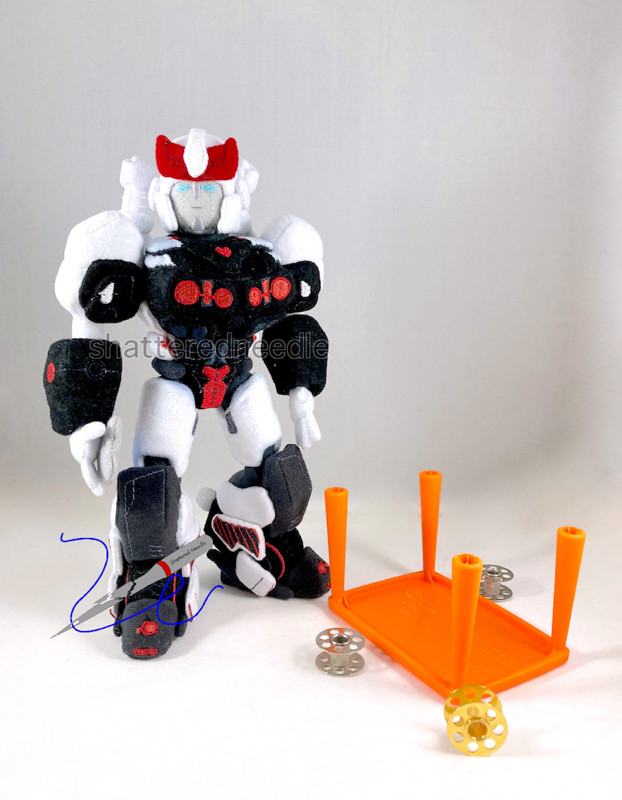 Custom handmade Prowl plush with a flipped over mini table