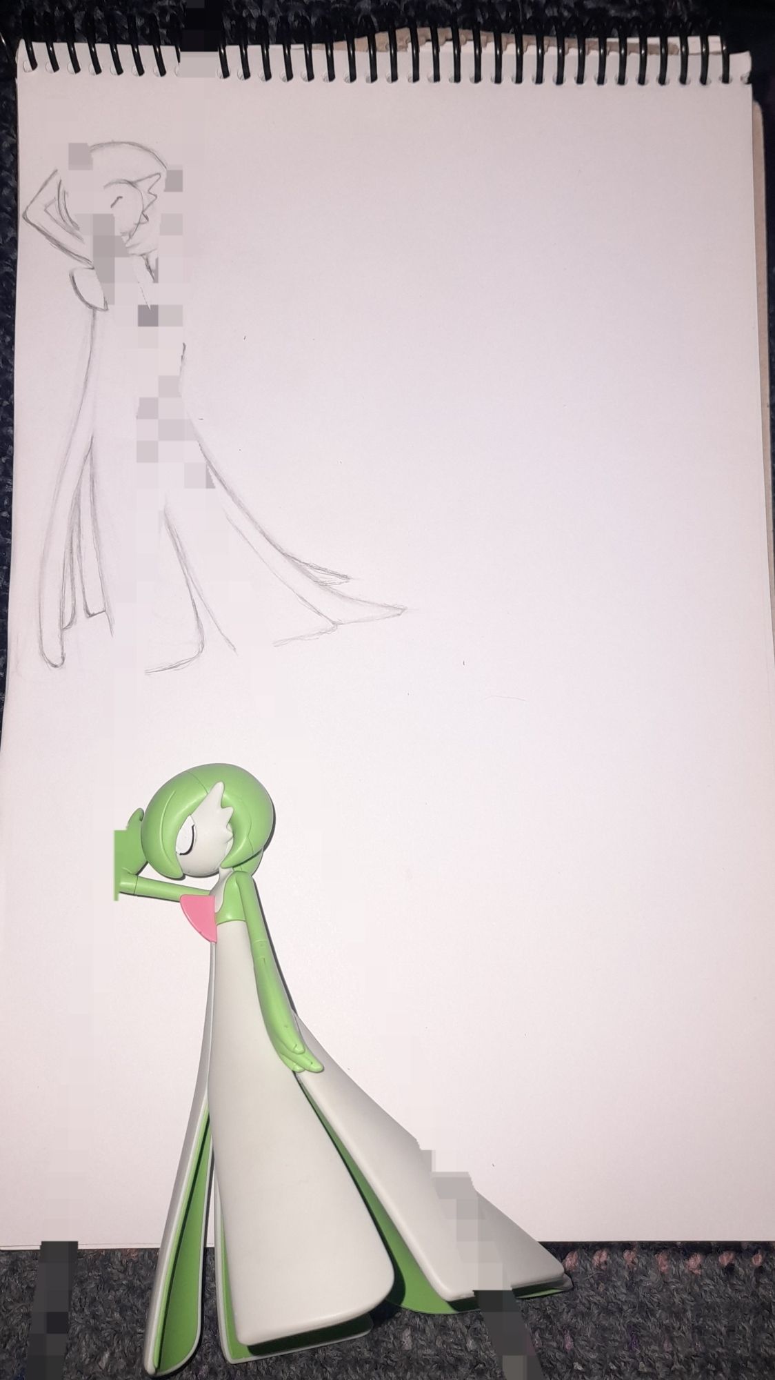 WORK IN PROGRESS:
2d paper & pencil art of Gardevoir from Pokémon (3rd Generation [Ruby; Sapphire; Emerald]), based on an official figure of the same pokémon
(pixelated due to certain concerns)