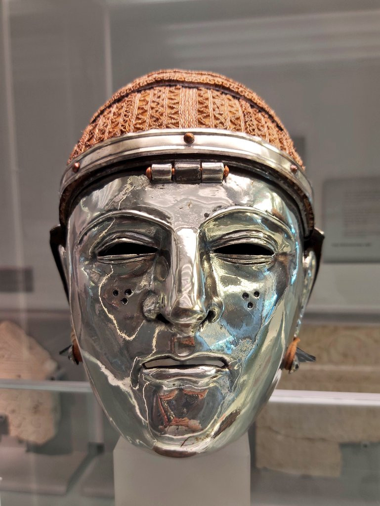 Reconstruction of a silver-plated face helmet with elaborate hairdo made of horse hair