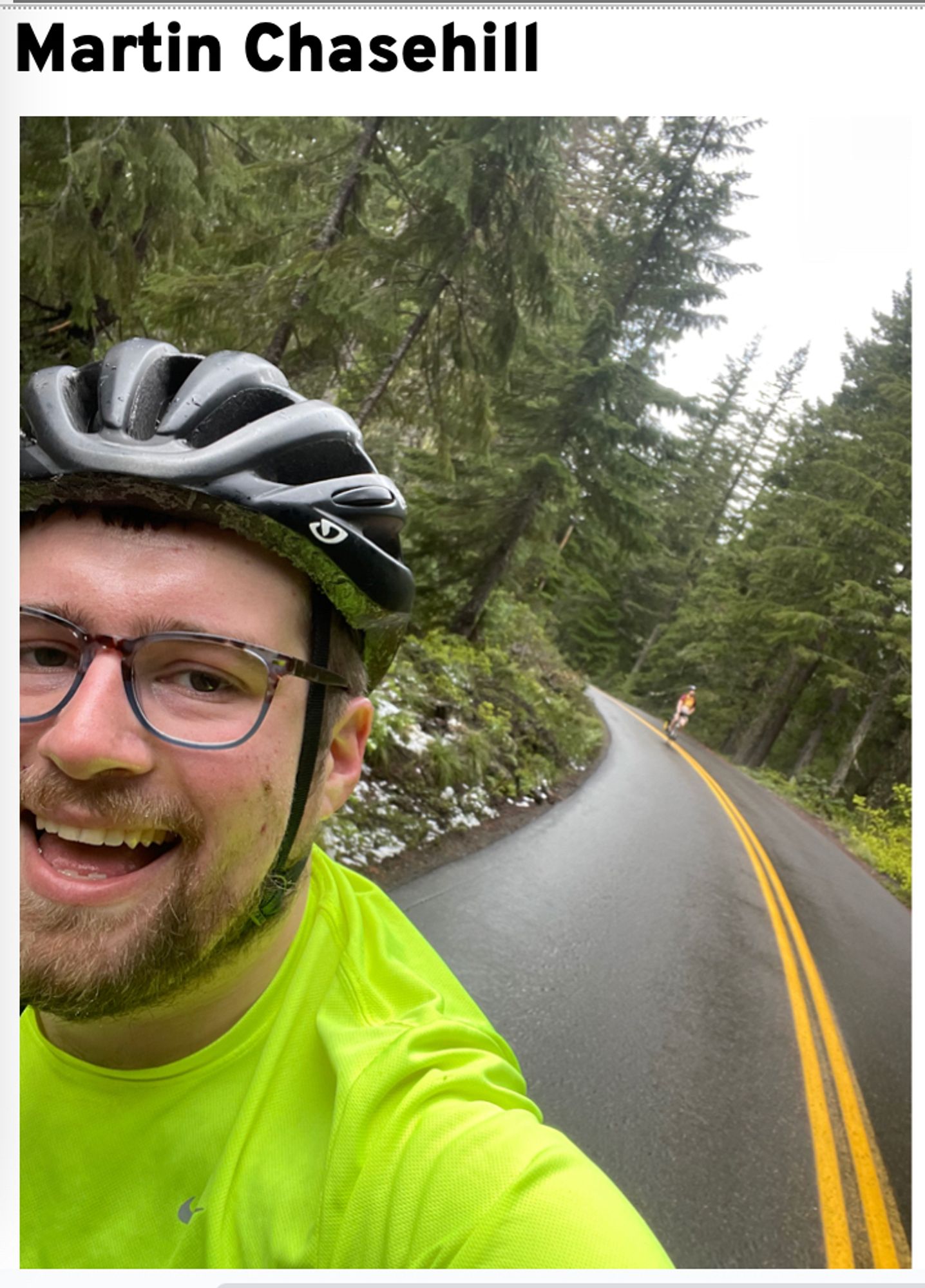 Photo of Martin Chasehill biking on a road in a forested setting.