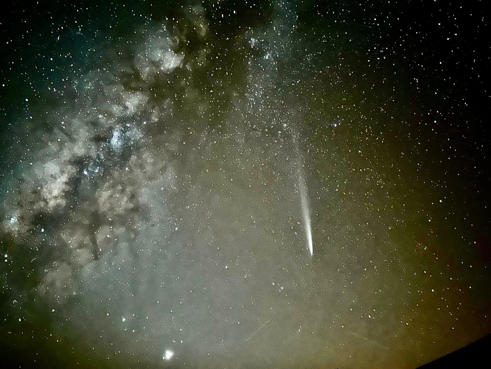 The milky way and the comet passing by. A beautiful photo taken with a phone.