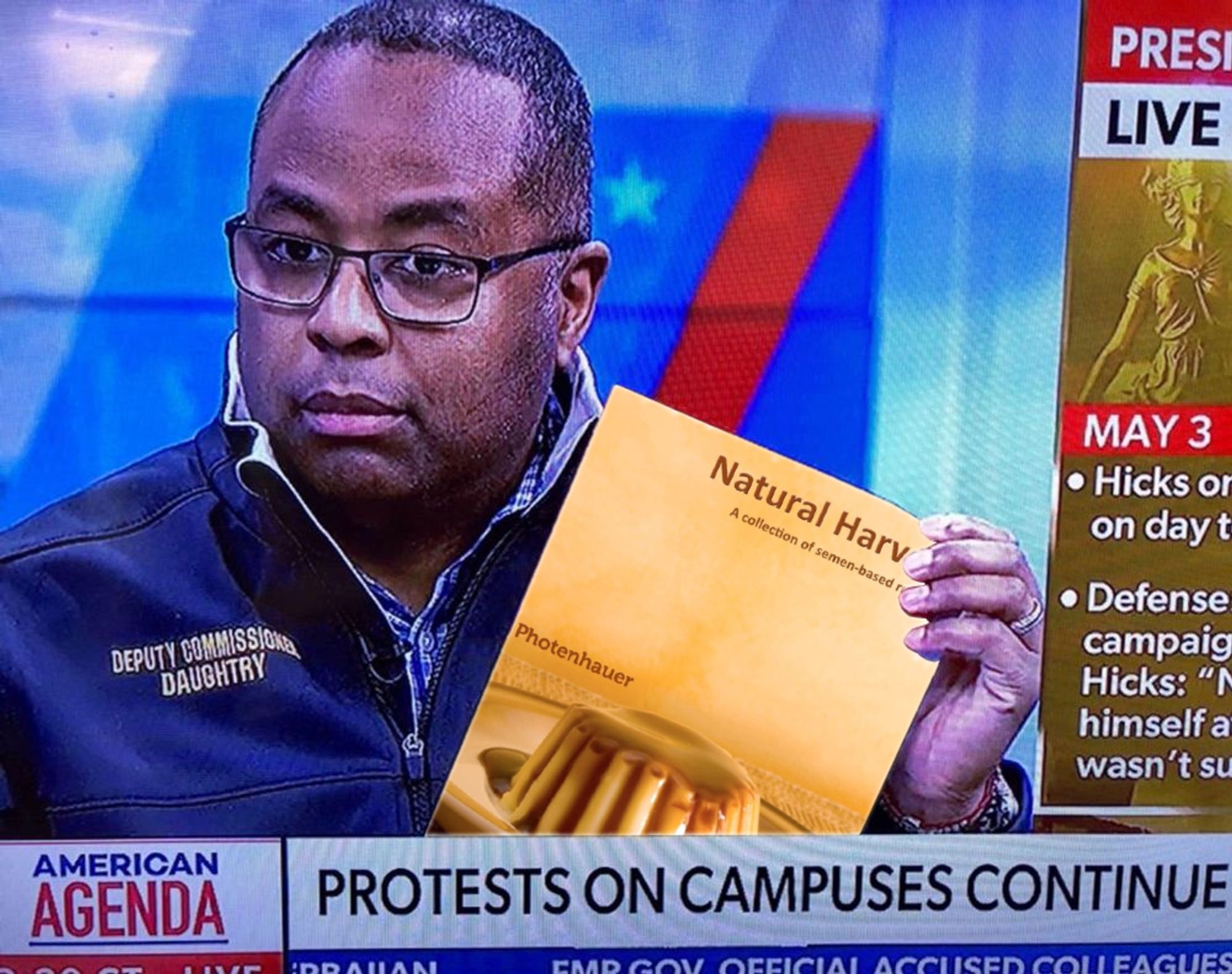 Idiot cop holds copy of "Natural Harvest, a collection of semen-based recipes"