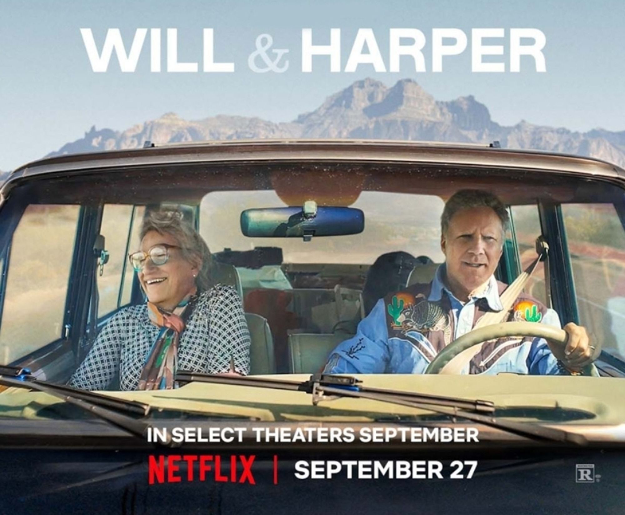 Publicity image for the Netflix documentary Will & Harper, showing Harper (in the passenger seat) and Will (driving) in a car, viewed through the front windshield, both smiling, with desert and mountains in the background.