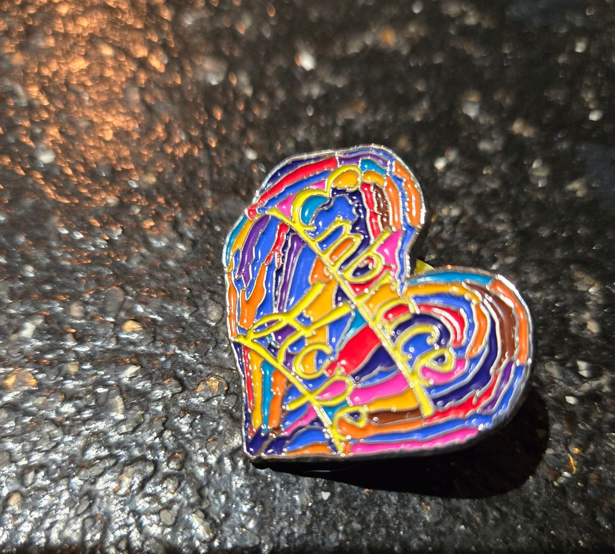 Enameled gift pin from Penzey's spices "Embrace Hope" in rainbow colors.