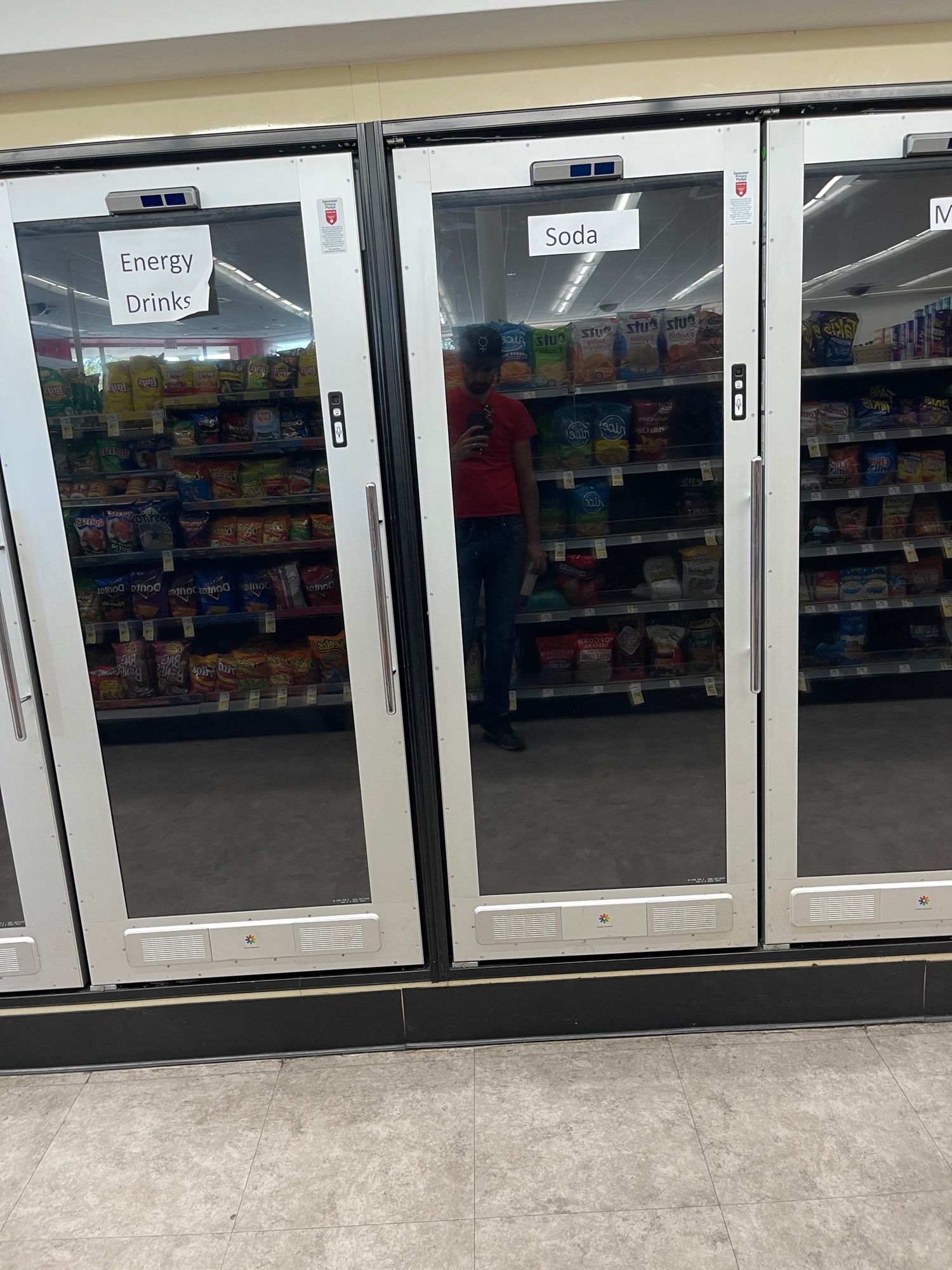 A photo of blank refrigerator doors at Walgreens made of LCD screens