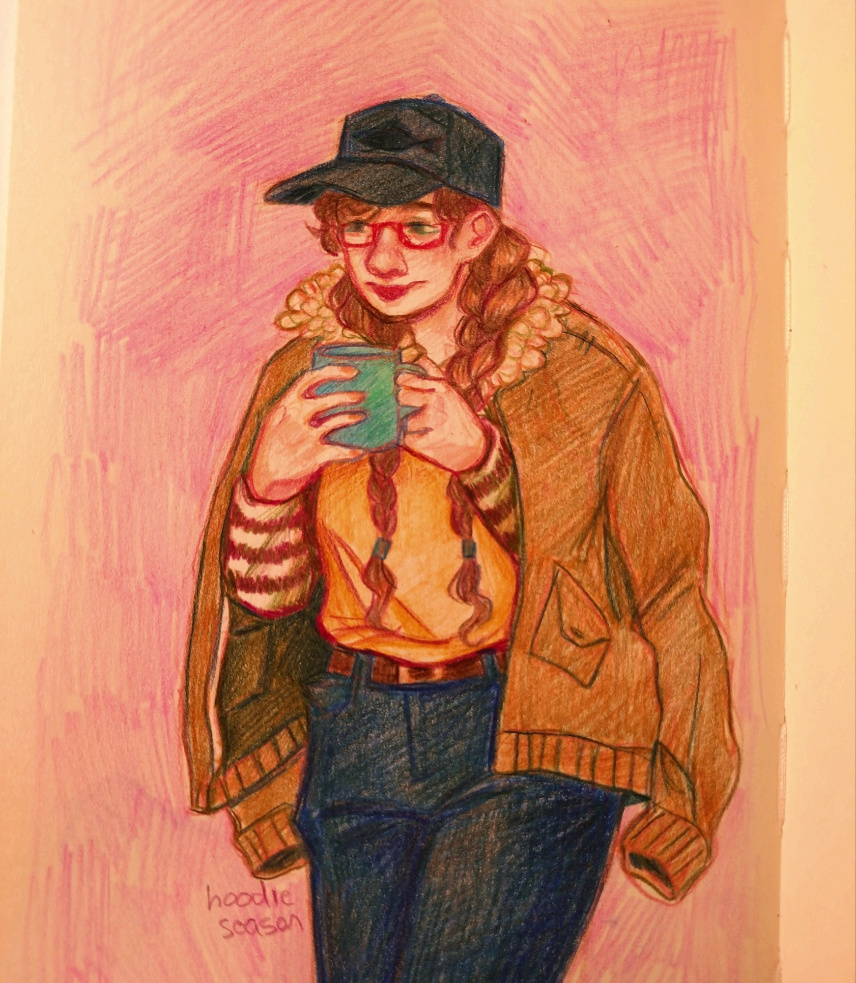 A drawing of Geminitay done in colored pencil. She is dressed in a yellow shirt, dark jeans and a tan jacket on her shoulders. She is wearing a dark blue cap with a fish on it. Her hair is braided, and she has a teal mug in her hands.