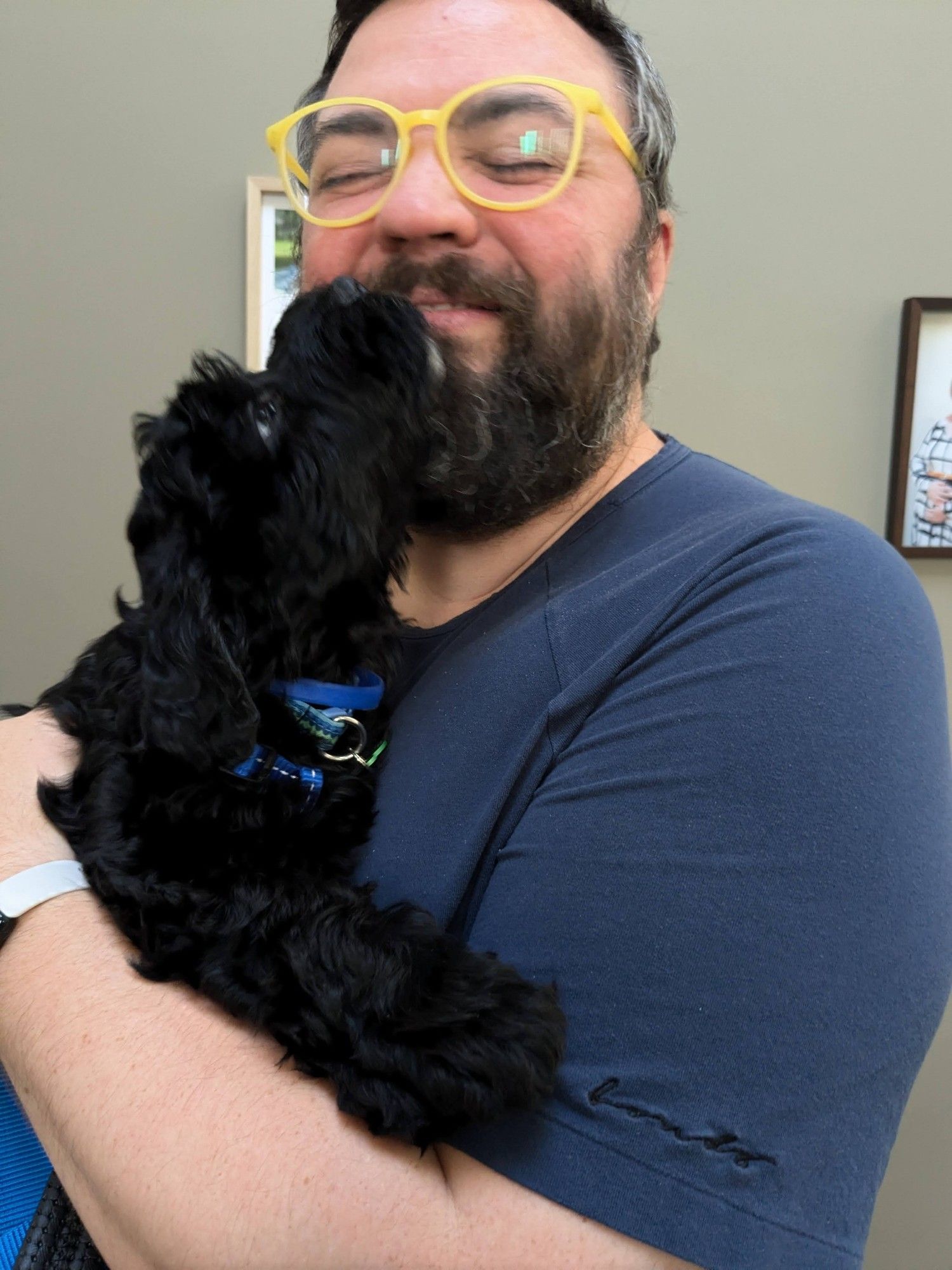 Callisto licking my face and chewing on my beard.