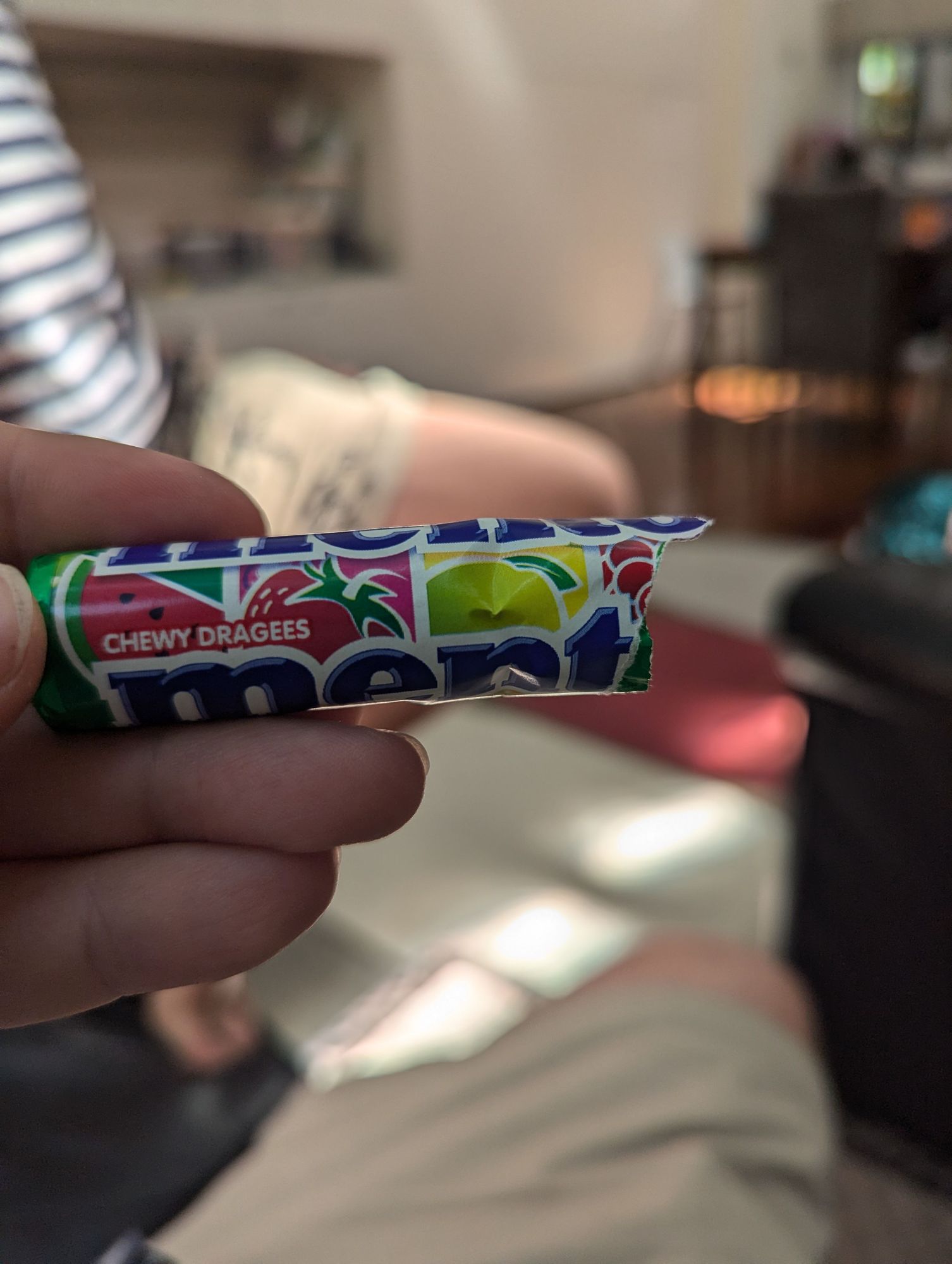 A half-packet of fruit Mentos, from left to right, Watermelon, Strawberry, and some yellow fruit that I would have said was lemon but MAYBE IT'S YUZU WHO KNOWS?