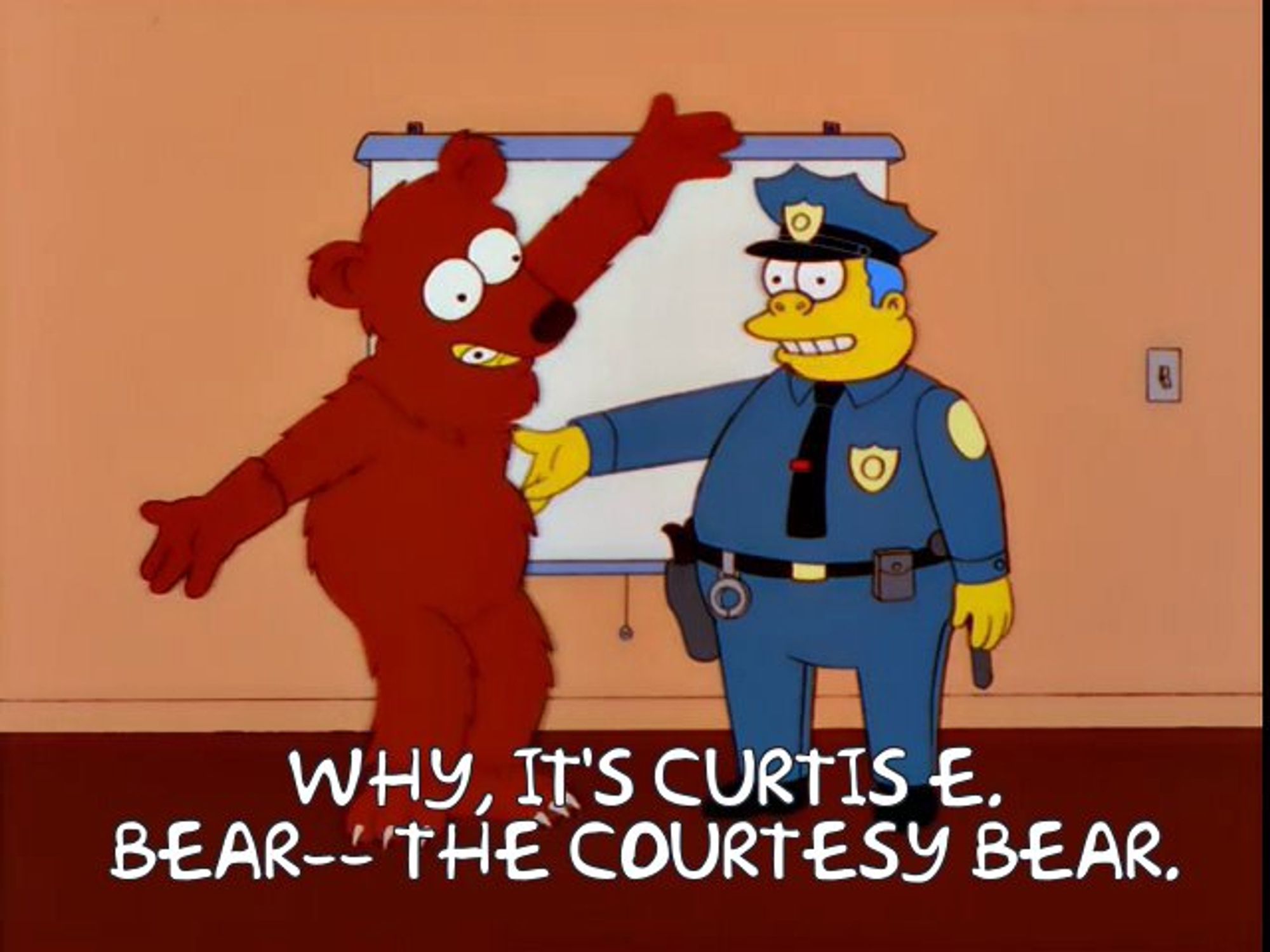 Curtis E. Bear, the Courtesy Bear, being introduced by Chief Wiggum during his anti-road-rage course.