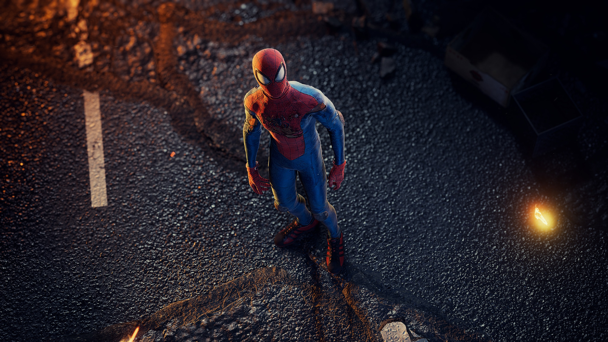 Photo of Spider-Man in the suit Peter gave him just before leaving for an extended trip. He's looking up at the camera from the ground below.