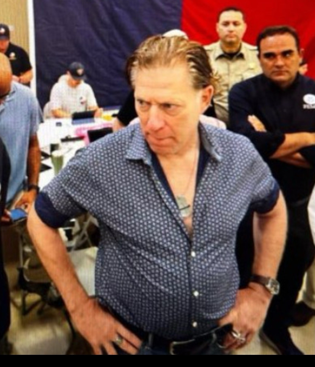 head of fema David Richardson on the scene in texas wearing a half buttoned shirt like an extra in a 70s porno 