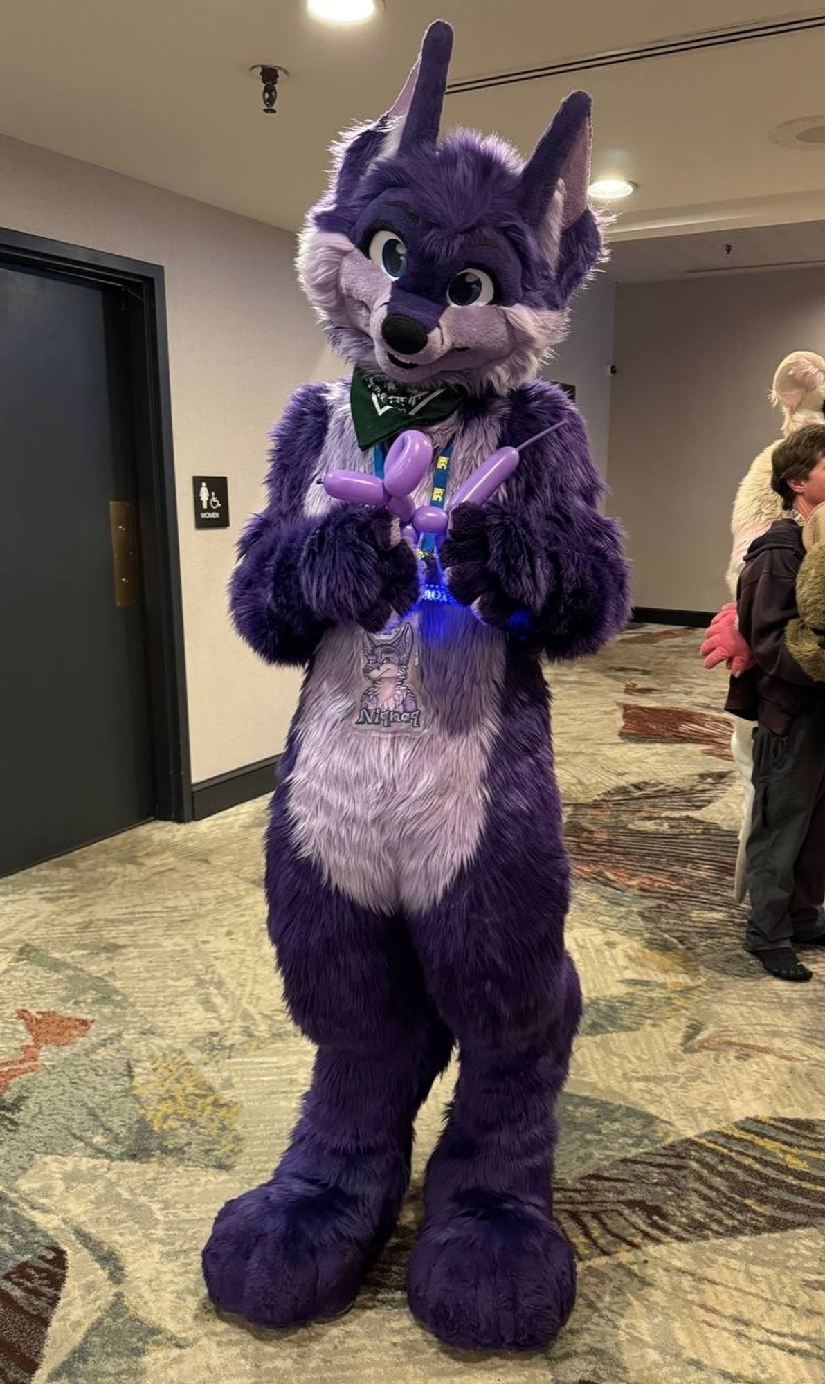 Fullsuit, holding balloon animal