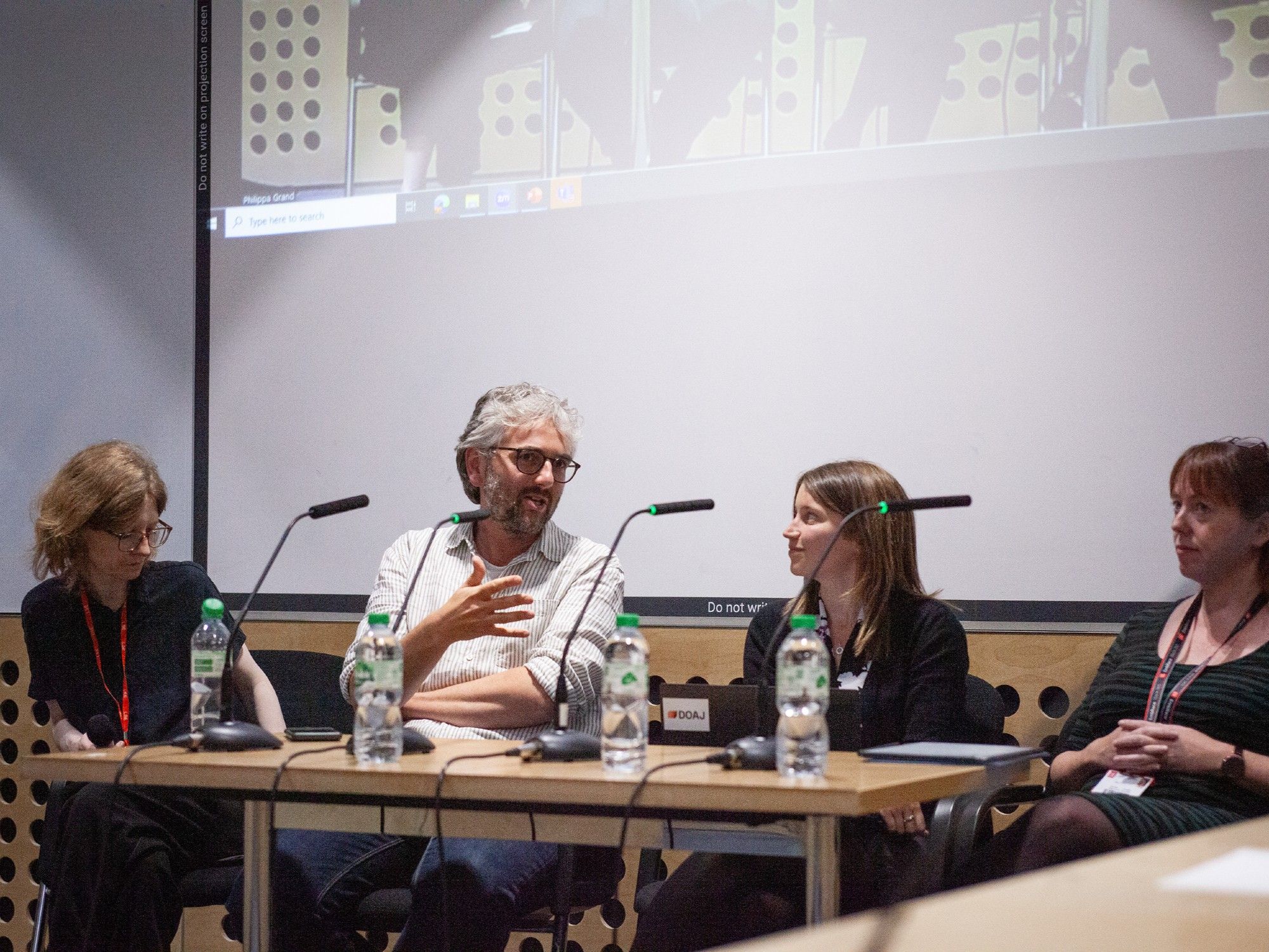 The chair and three of the panellists at the front of the room