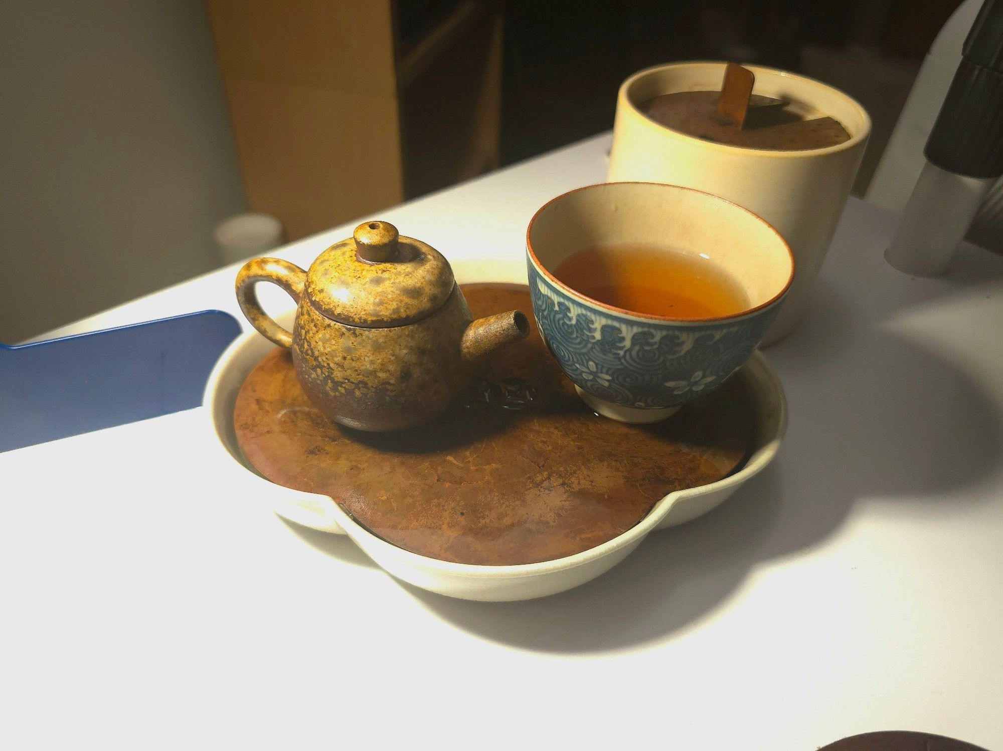 My smallest teapot. Something like 60-65ml capacity, a very cool woodfired pot splotched with light and dark browns. Also using a ~90 ml painted qinghua cup