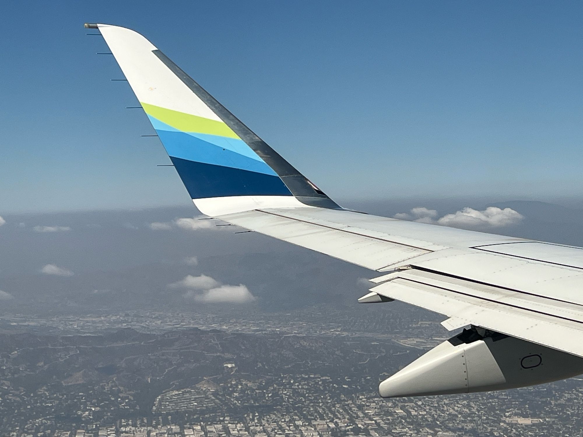 Griffith in the distance with the port-side wing of the Alaska Airlines E175.