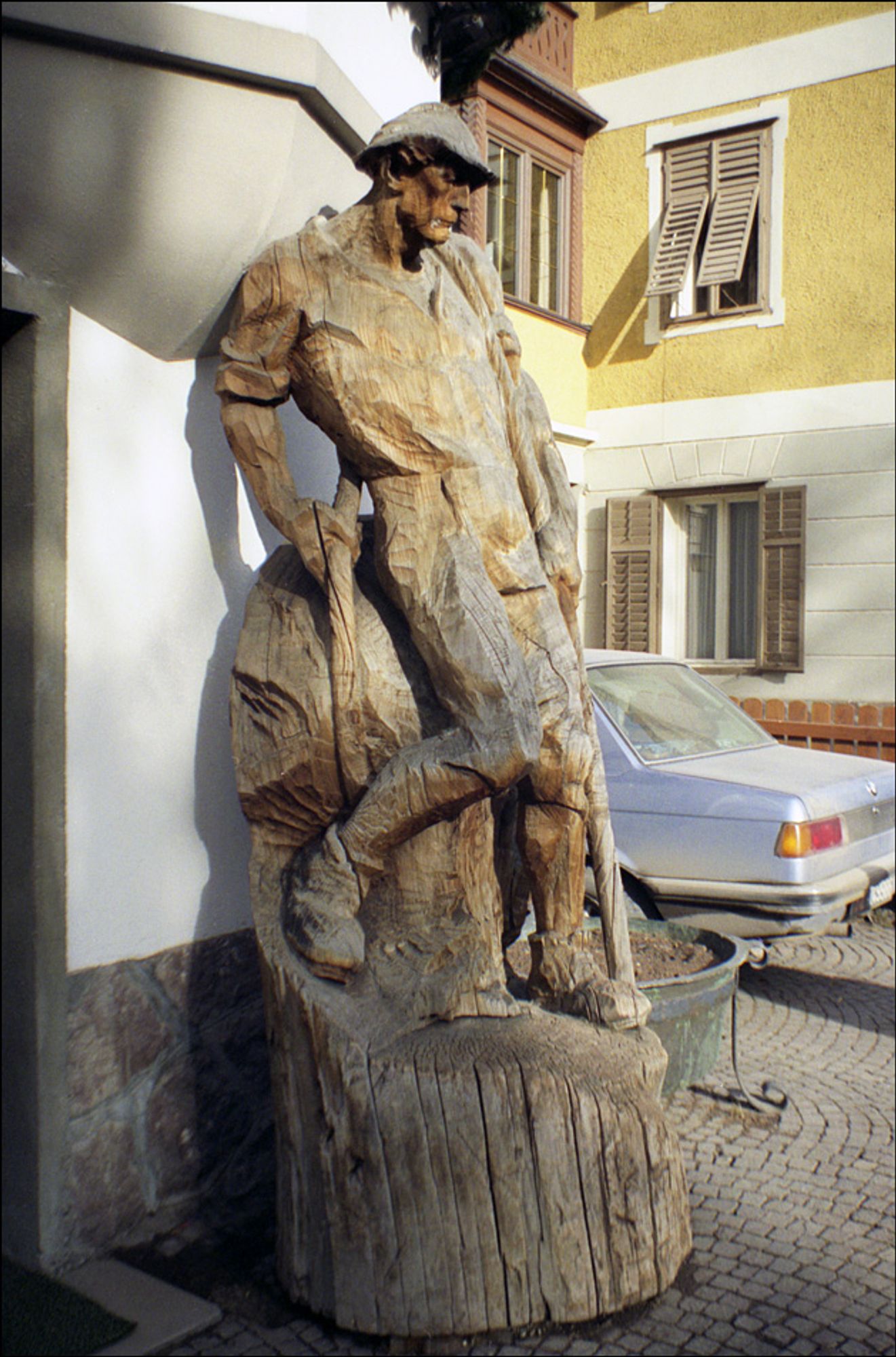 Man of the mountain carved from a treetrunk and left to weather in the street in Ortisei, Val Gardena, Italy, 1992.