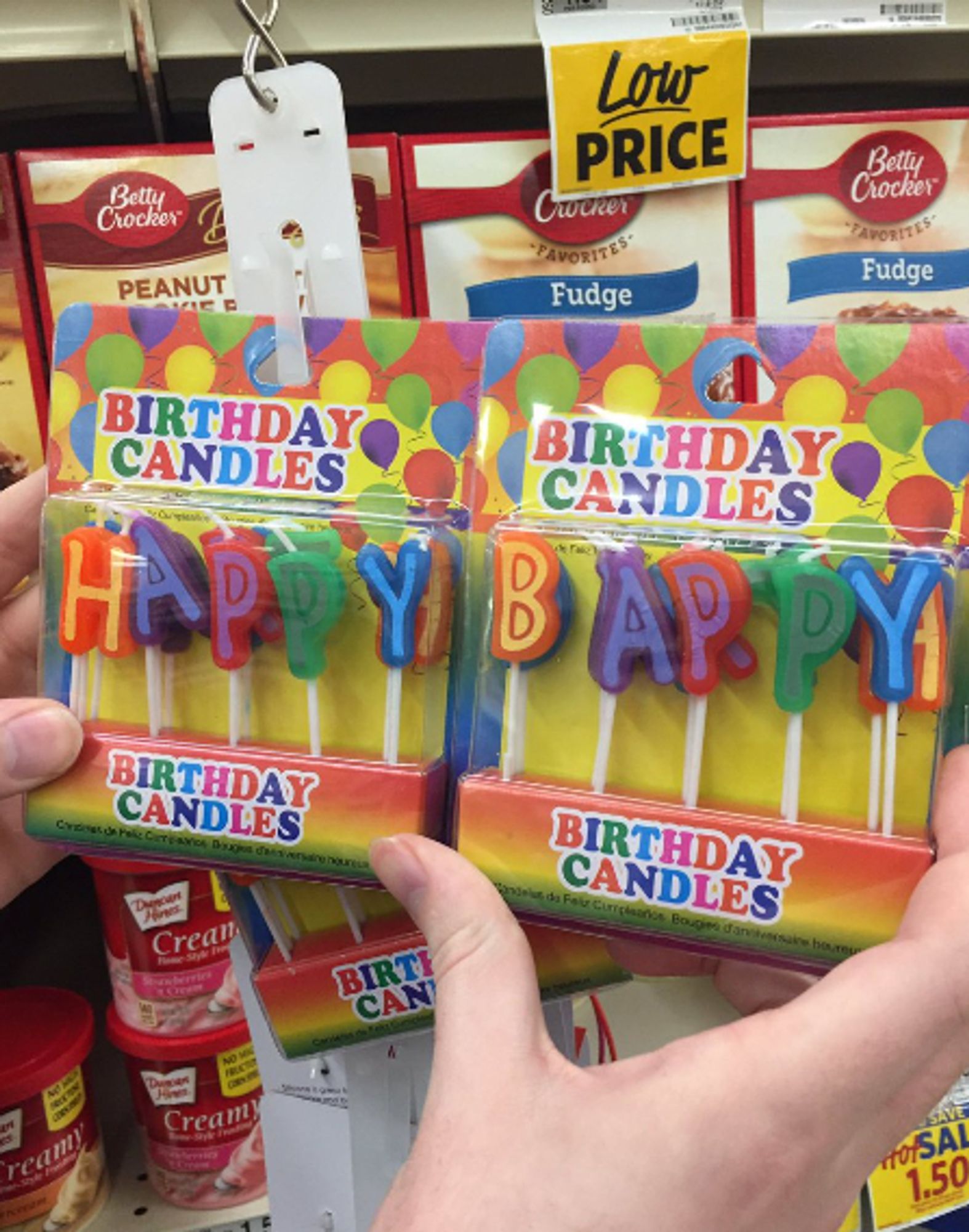 Image of two seperate boxes of birthday candles which, placed next to each other, spell "HAPPY BAPPY"