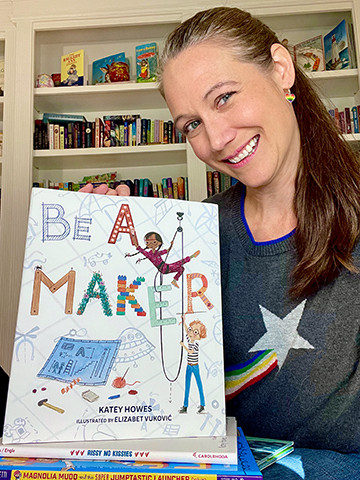 Katey holding "Be a Maker."