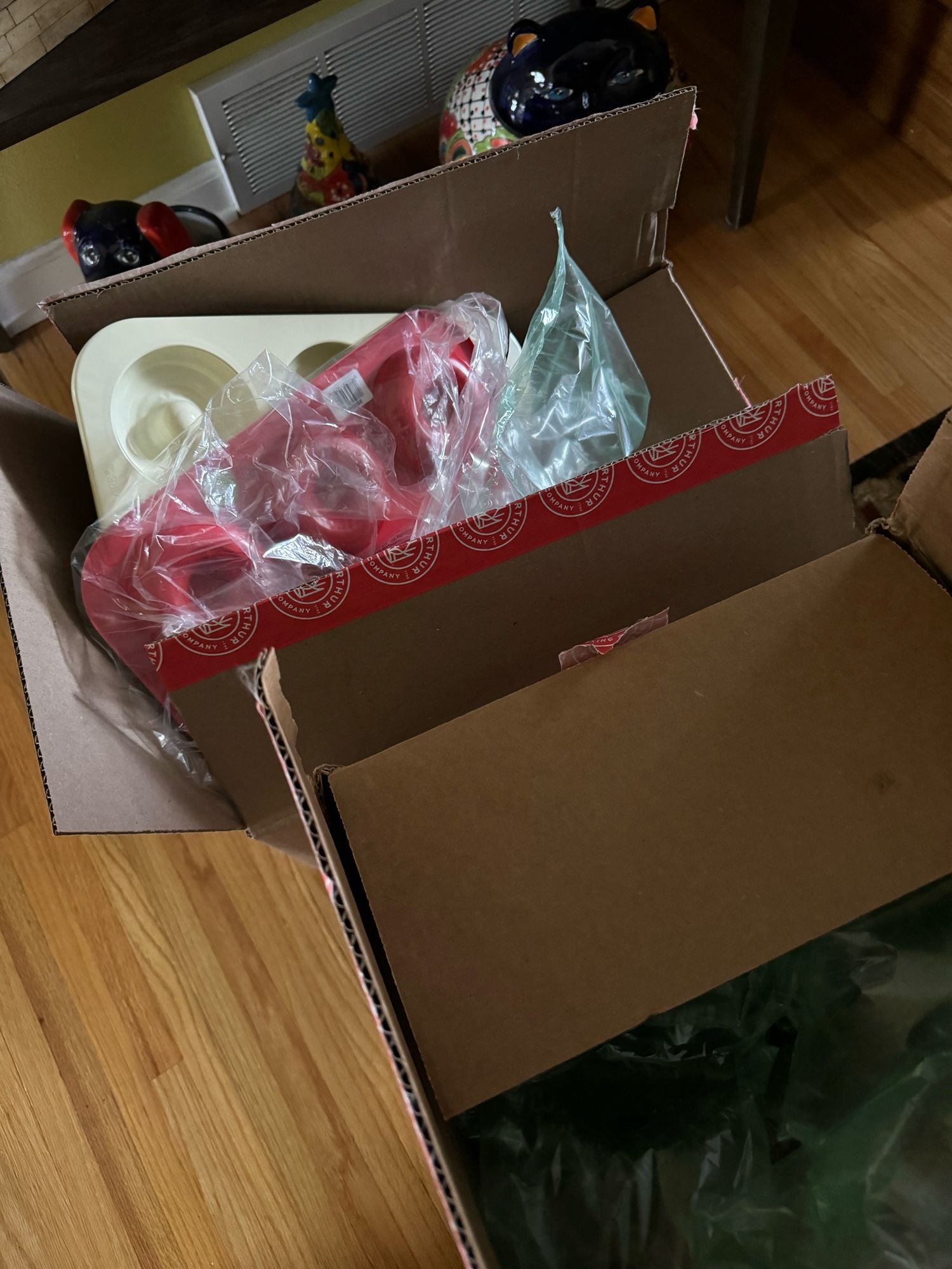 Two boxes full of baking supplies, including donut pans because I need a little breakfast variety.