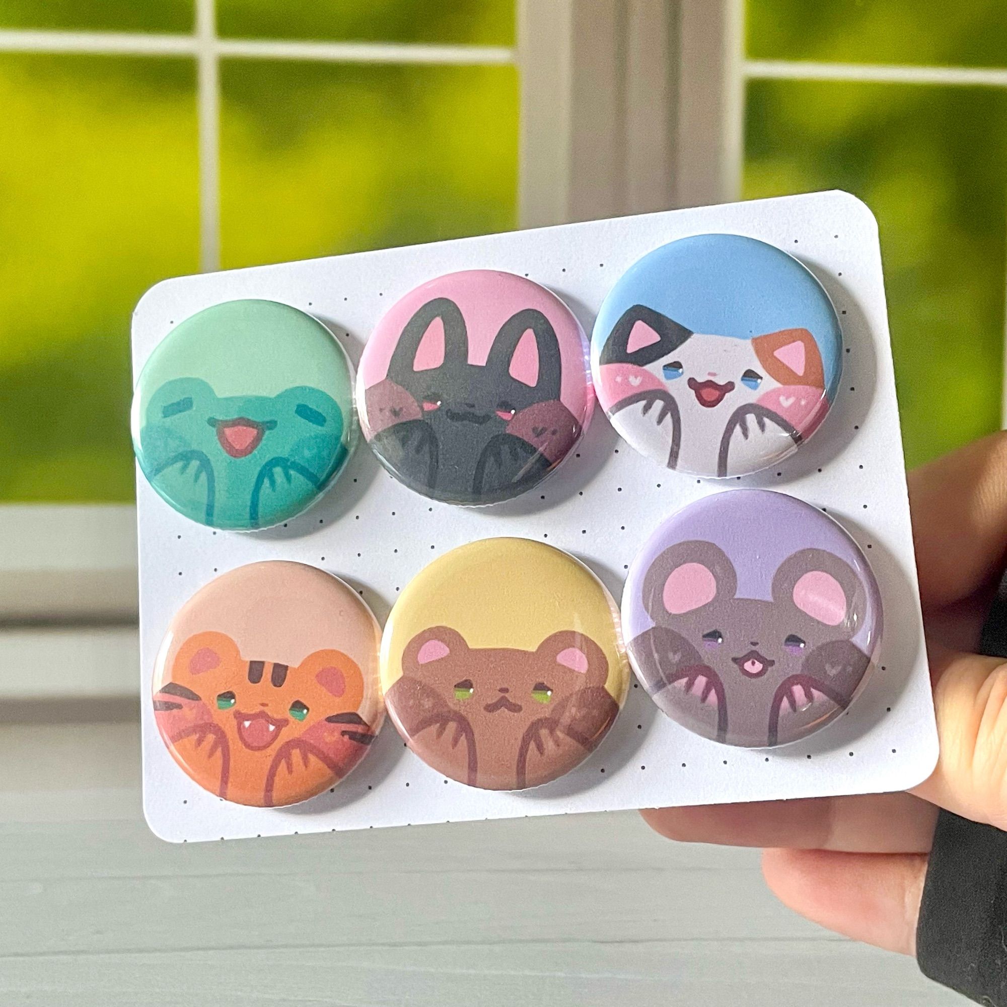 1.25 inch round buttons available as pin-back or magnet, ft. Frog, Bunny, Calico Cat, Tiger, Bear, Mouse