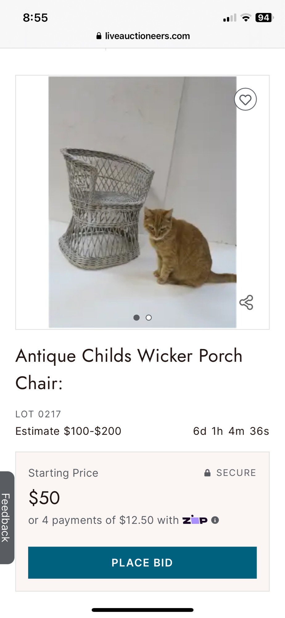 auction listing 
Antique Childs Wicker Porch Chair,
photo of the piece of furniture with a fluffy orange cat sitting nearby on the floor