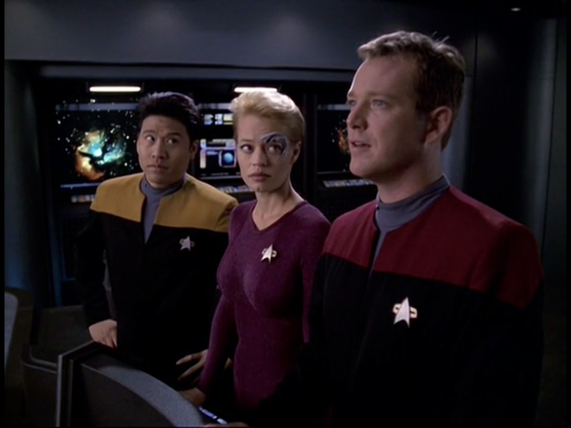 The same scene, a moment later. Tom is continuing to look at the screen, absolutely enraptured by the space ship he's looking at on the viewscreen. Seven and Harry have turned their heads to look at Tom, they both look concerned, and slightly bemused. 

From Star Trek Voyager, Season 6, Episode 5, "Alice"