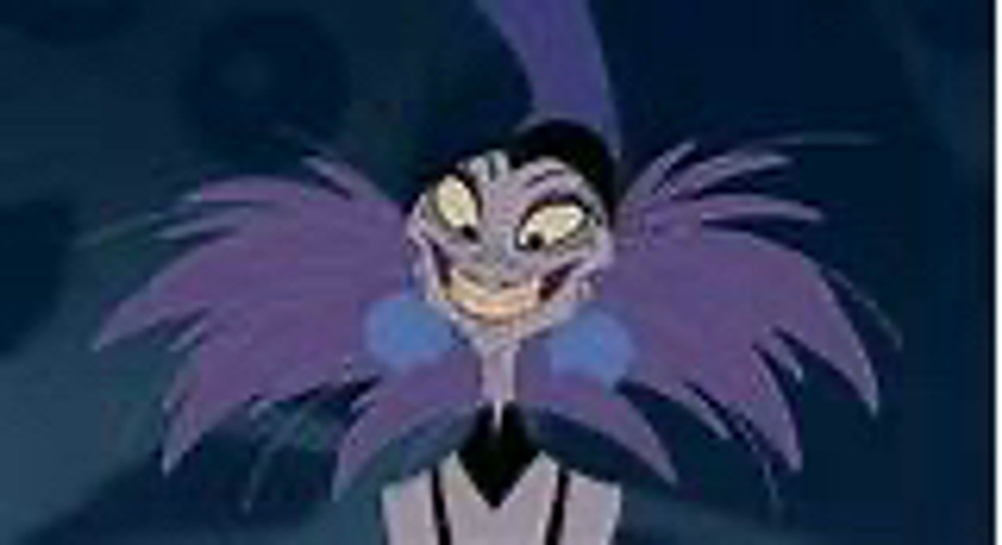 Yzma from the emperor’s new groove looking amazing with some kind of feather getup around her neck and a sleeveless gown. Big pompon earrings for some reason, too. You do you, queen.