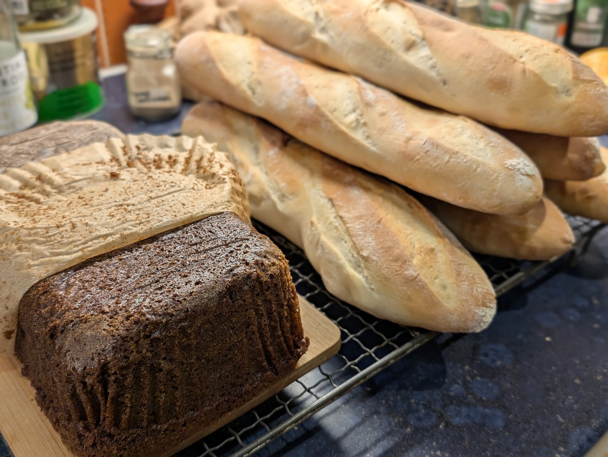 A big loaf of sticky gingerbread and half a dozen short baguettes.