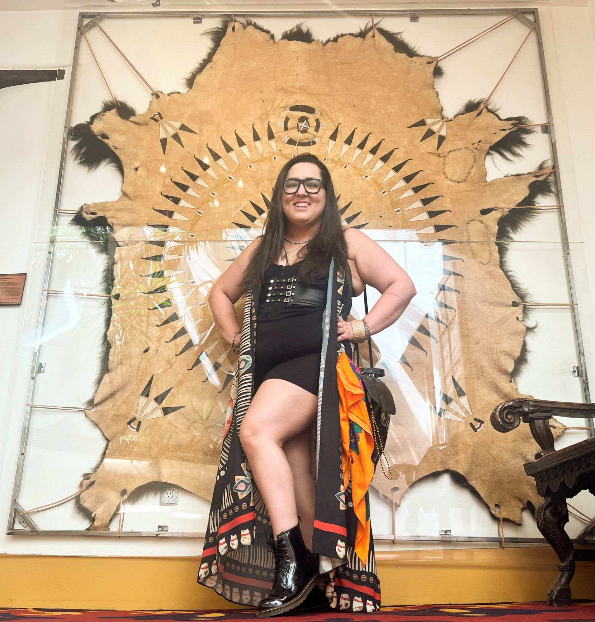 Me in a gothy outfit by J.Okuma, posed in front of a painted buffalo hide